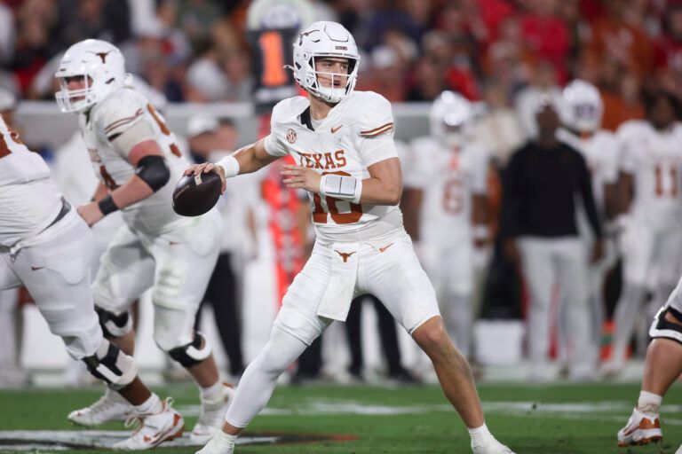Texas Longhorns quarterback Arch Manning (16) looks to make a pass in the second half against the Georgia Bulldogs at Sanford Stadium.