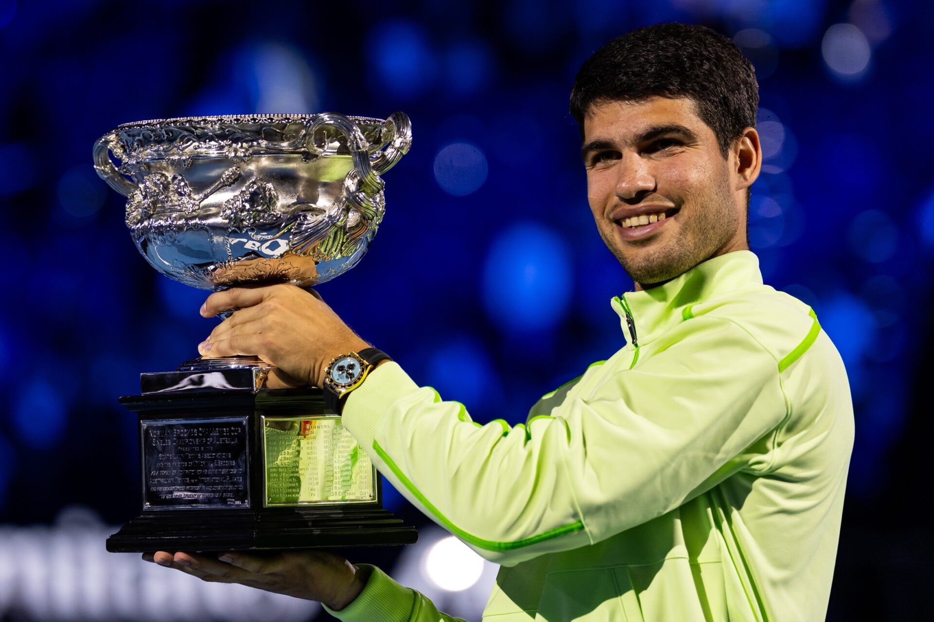 Carlos Alcaraz of Spain with the Norman Brookes Challenge Cup after his victory over Novak Djokovic of Serbia in the final of the mens singles at the Australian Open at Rod Laver Arena in Melbourne Park.
