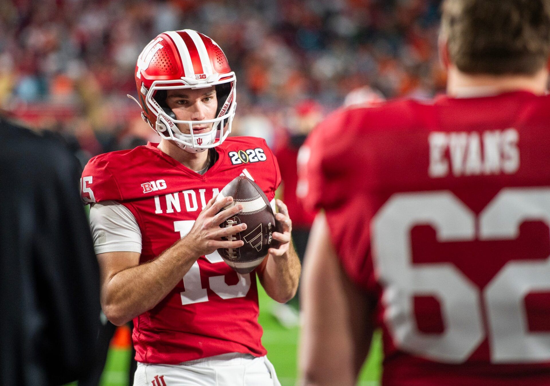 Indiana's Fernando Mendoza (15) gets loose before the College Football Playoff National Championship college football game at Hard Rock Stadium in Miami Gardens on Monday, Jan. 19, 2026.