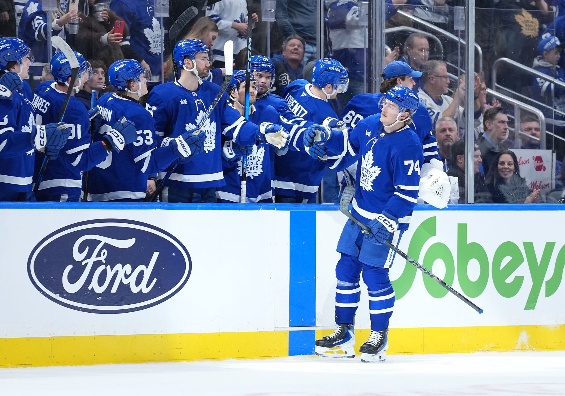 Toronto Maple Leafs center Bobby McMann (74) celebrates at the bench after scoring a goal against the Vegas Golden Knights during the second period at Scotiabank Arena.