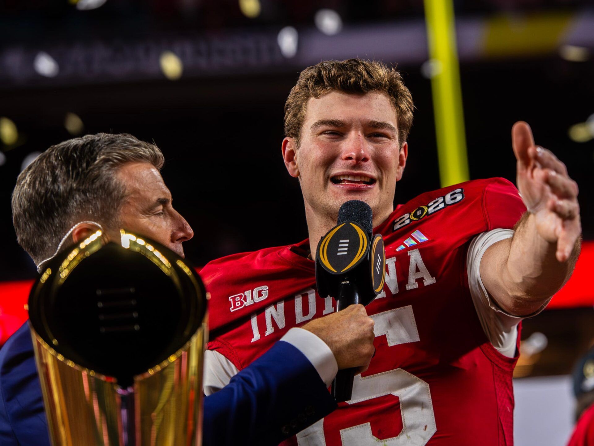 Indiana's Fernando Mendoza (15) talks to the crowd on the podium after the College Football Playoff National Championship college football game at Hard Rock Stadium in Miami Gardens on Monday, Jan. 19, 2026.