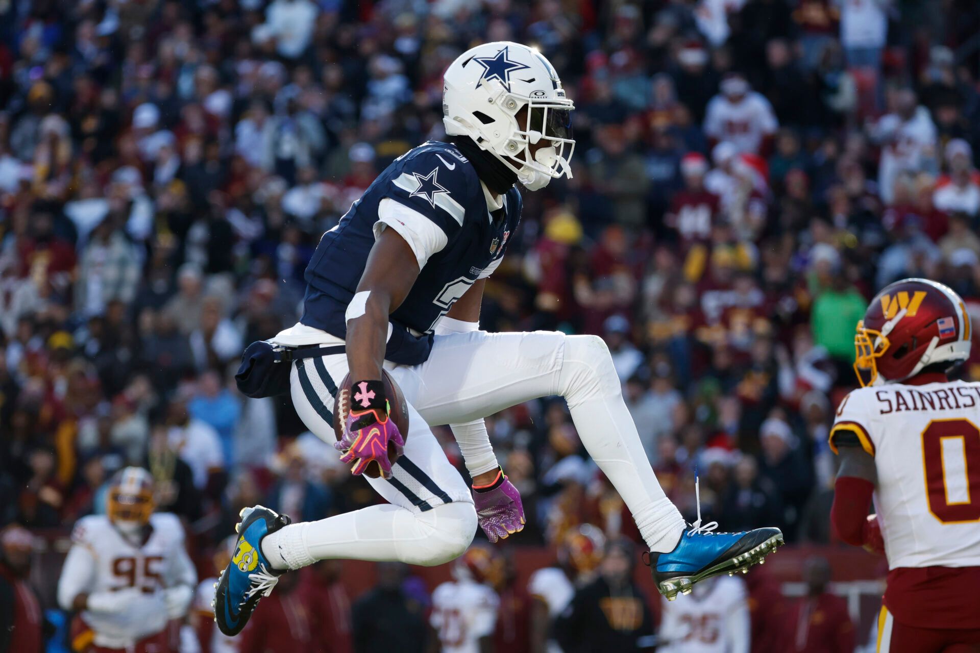 Dallas Cowboys wide receiver George Pickens (3) celebrates after a play against the Washington Commanders during the first half at Northwest Stadium.