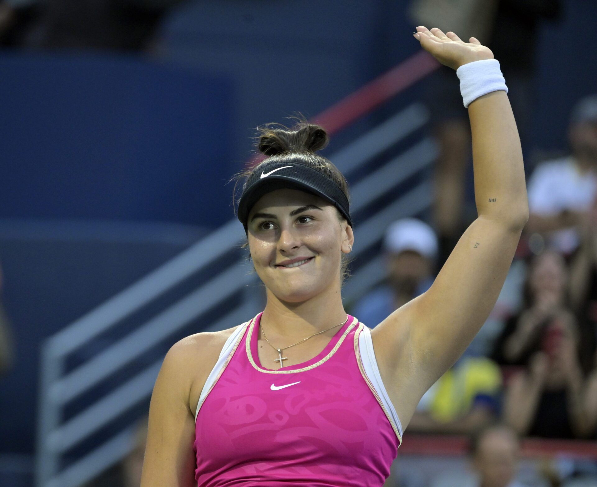 Bianca Andreescu (CAN) waves to the crowd before her match against Camila Giorgi (ITA) (not pictured) during first round play at IGA Stadium.