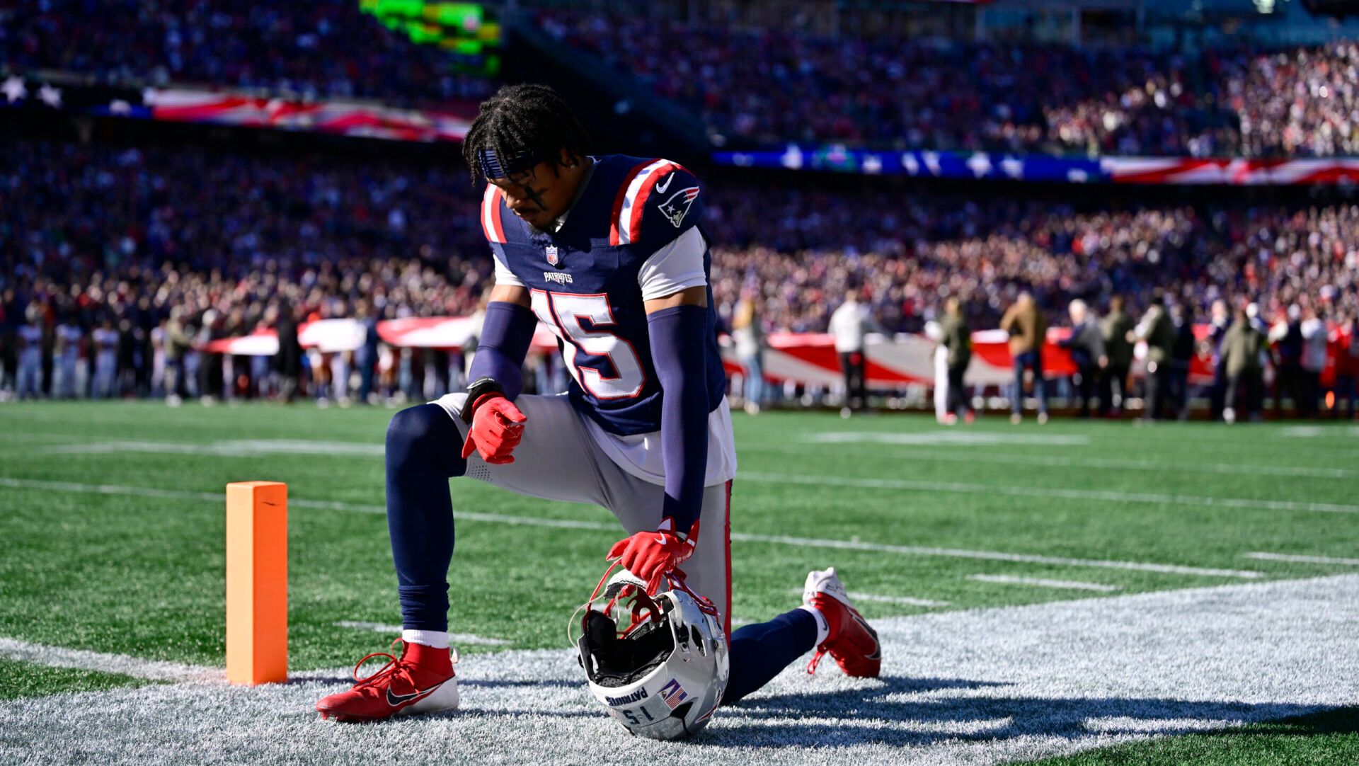 FOXBOROUGH, MASSACHUSETTS - NOVEMBER 02: Marte Mapu #15 of the New England Patriots prays before the game against the Atlanta Falcons  in the game at Gillette Stadium on November 02, 2025 in Foxborough, Massachusetts. (Photo by Billie Weiss/Getty Images)
