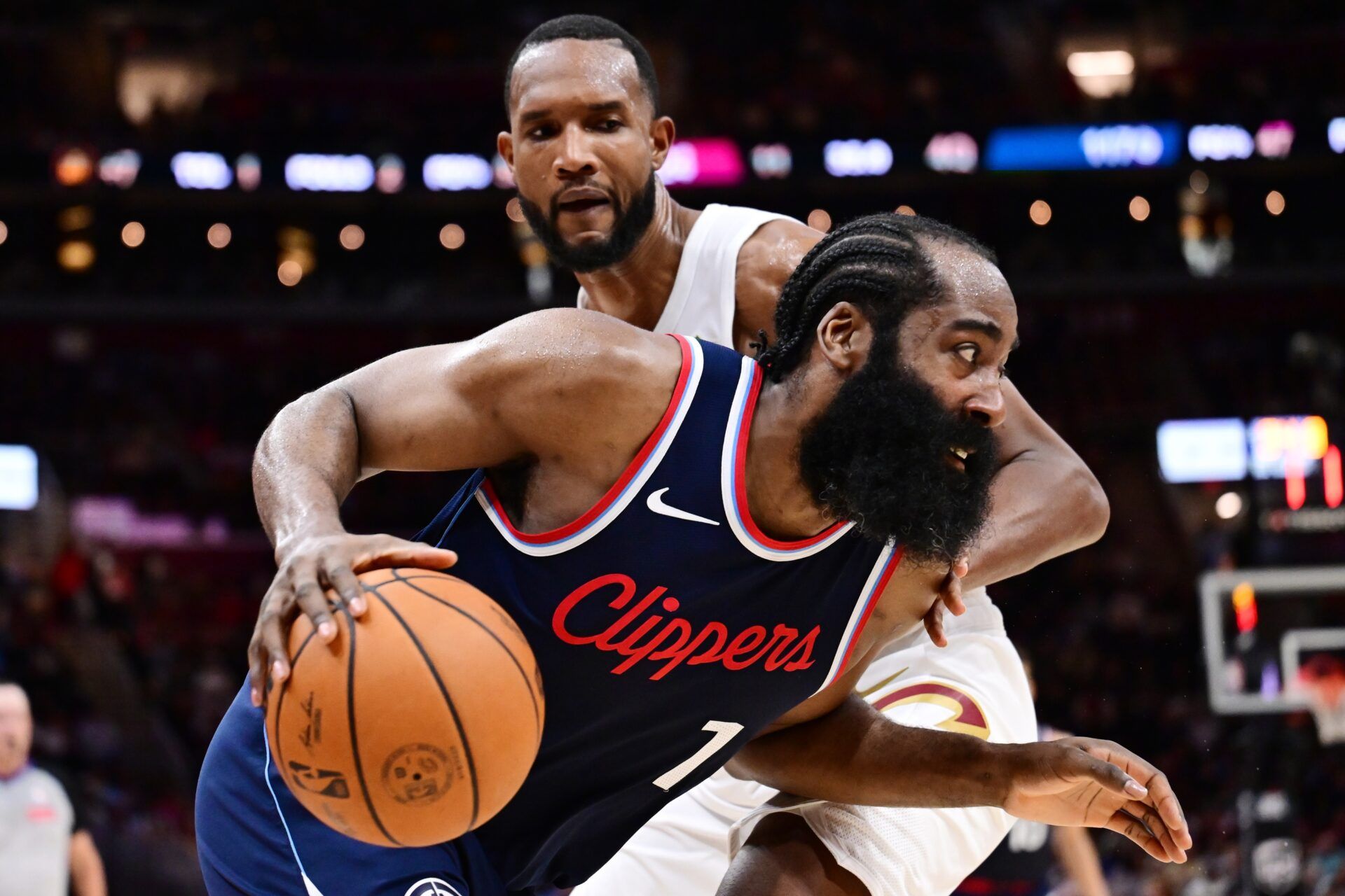 Los Angeles Clippers guard James Harden (1) drives to the basket against Cleveland Cavaliers forward Evan Mobley (4) during the second half at Rocket Arena.