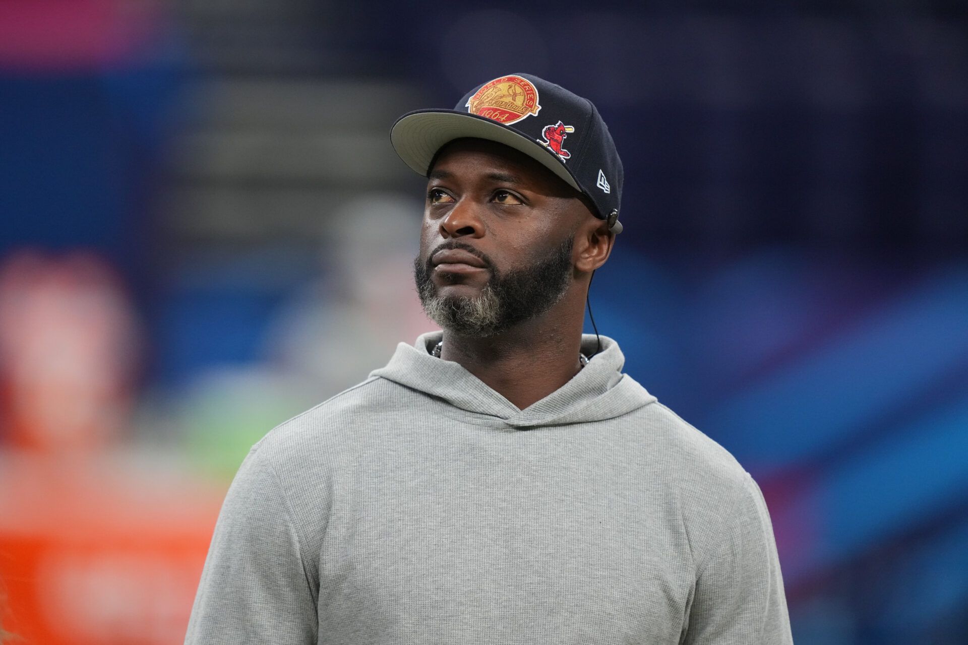 Former NFL player Reggie Wayne looks on during the 2025 NFL Combine at Lucas Oil Stadium.