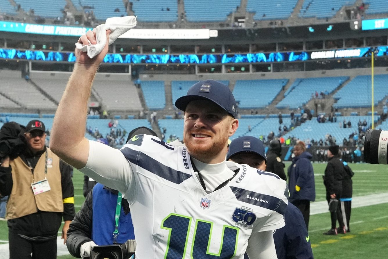 Seattle Seahawks quarterback Sam Darnold (14) reacts after the game at Bank of America Stadium.