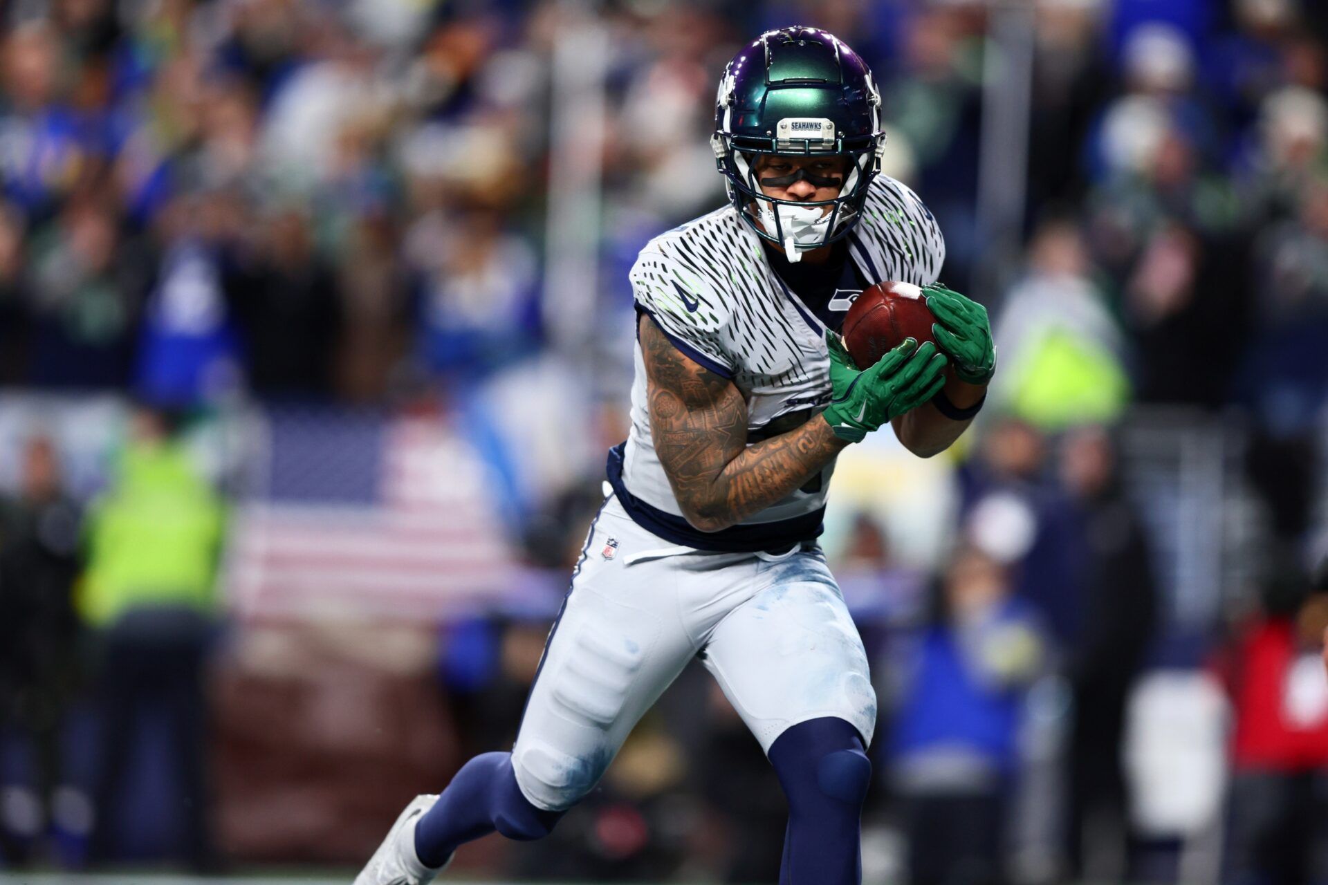 Seattle Seahawks wide receiver Jaxon Smith-Njigba (11) runs for a touchdown against the Los Angeles Rams in overtime at Lumen Field.