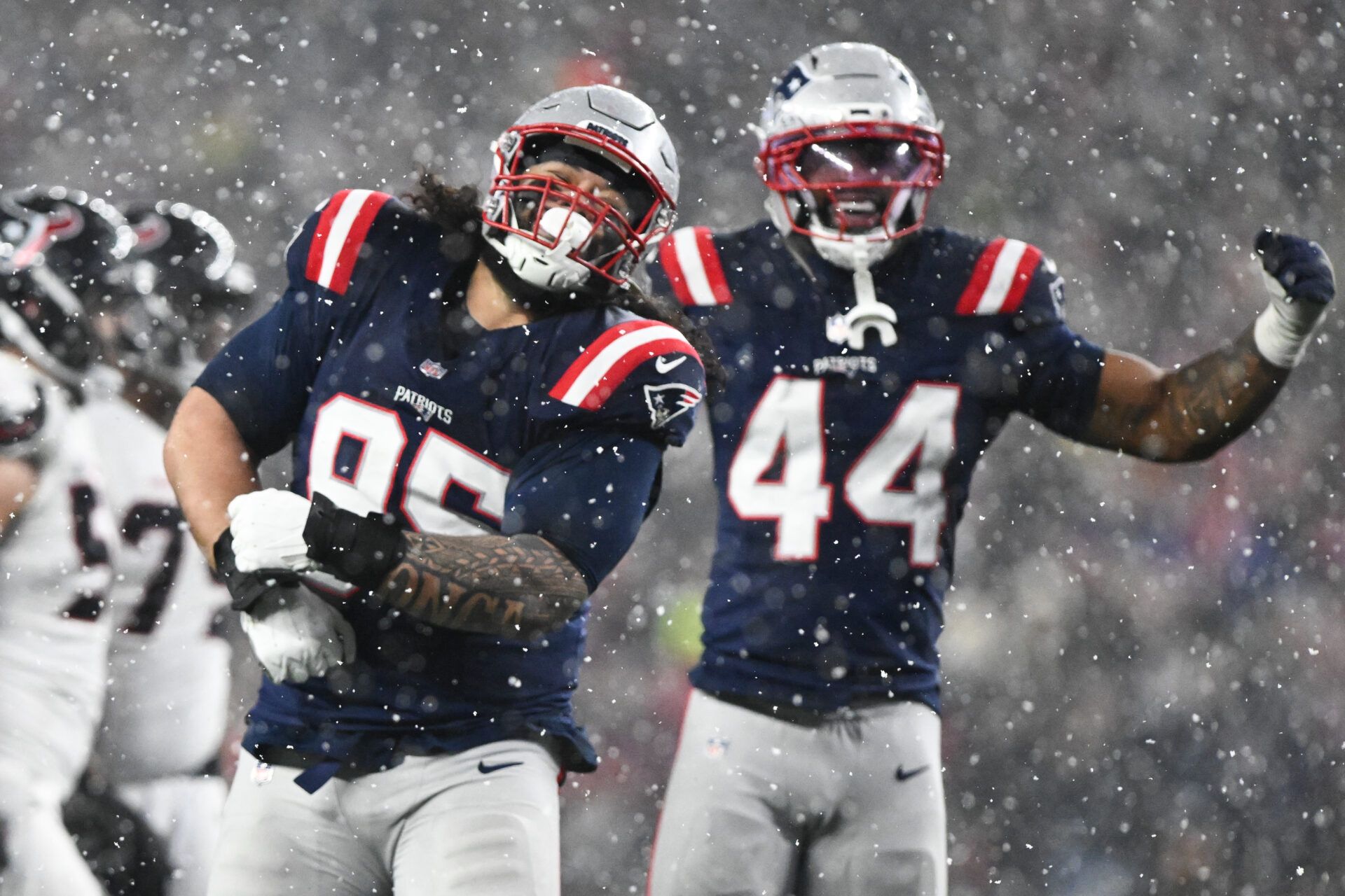 New England Patriots defensive lineman Khyiris Tonga (95) celebrates a sack in the fourth quarter against the New England Patriots in an AFC Divisional Round game at Gillette Stadium.