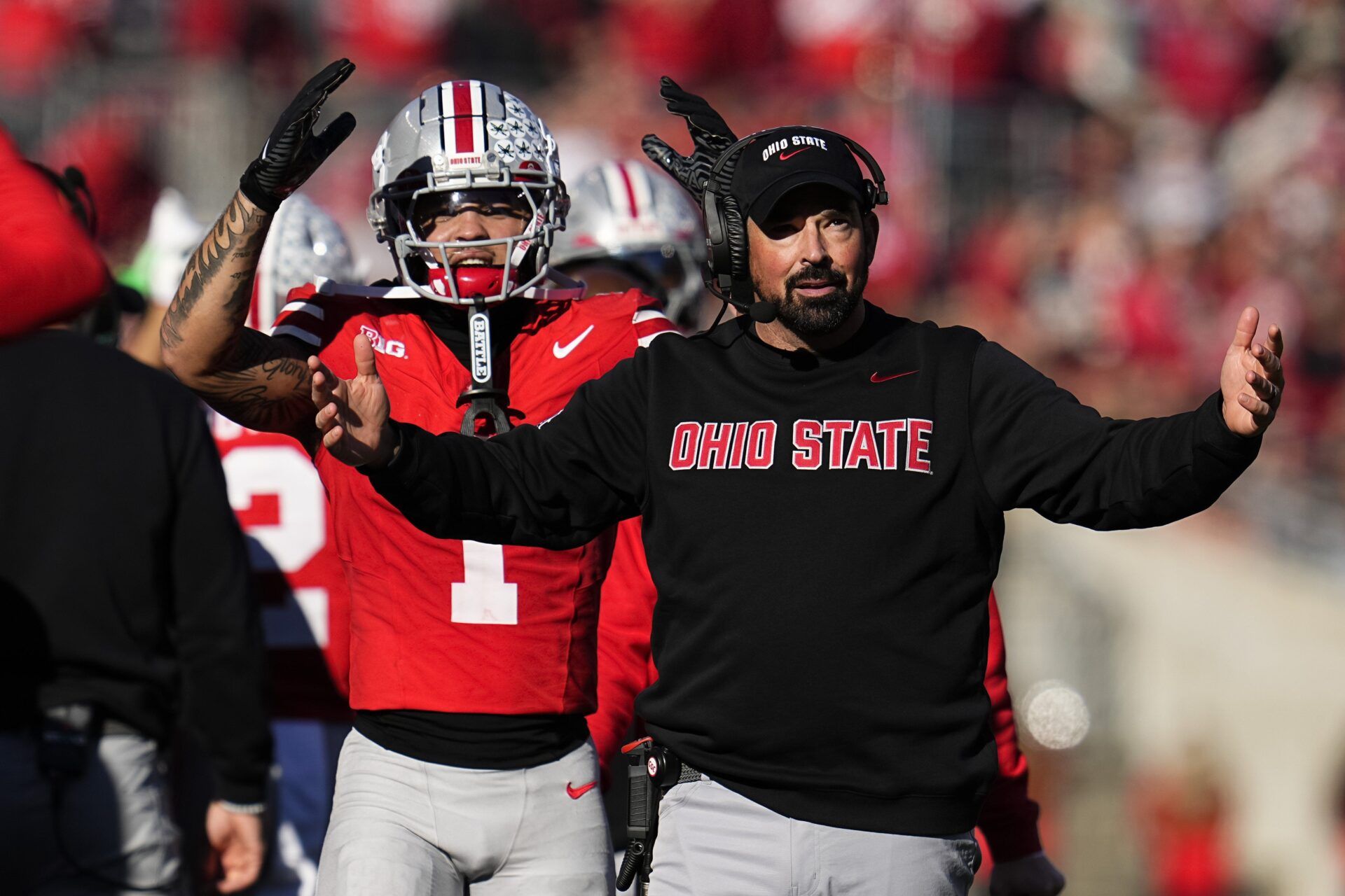 Ohio State Buckeyes head coach Ryan Day and wide receiver Brandon Inniss (1) react during the second half of the NCAA football game against the Rutgers Scarlet Knights at Ohio Stadium in Columbus on Nov. 22, 2025. Ohio State won 42-9.