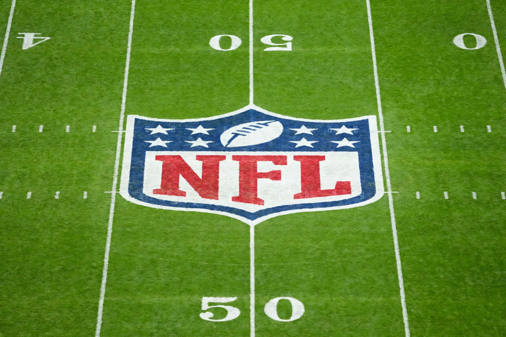 The NFL logo at midfield is seen prior to the 2025 NFL Madrid Game between the Miami Dolphins and the Washington Commanders at Santiago Bernabeu Stadium.