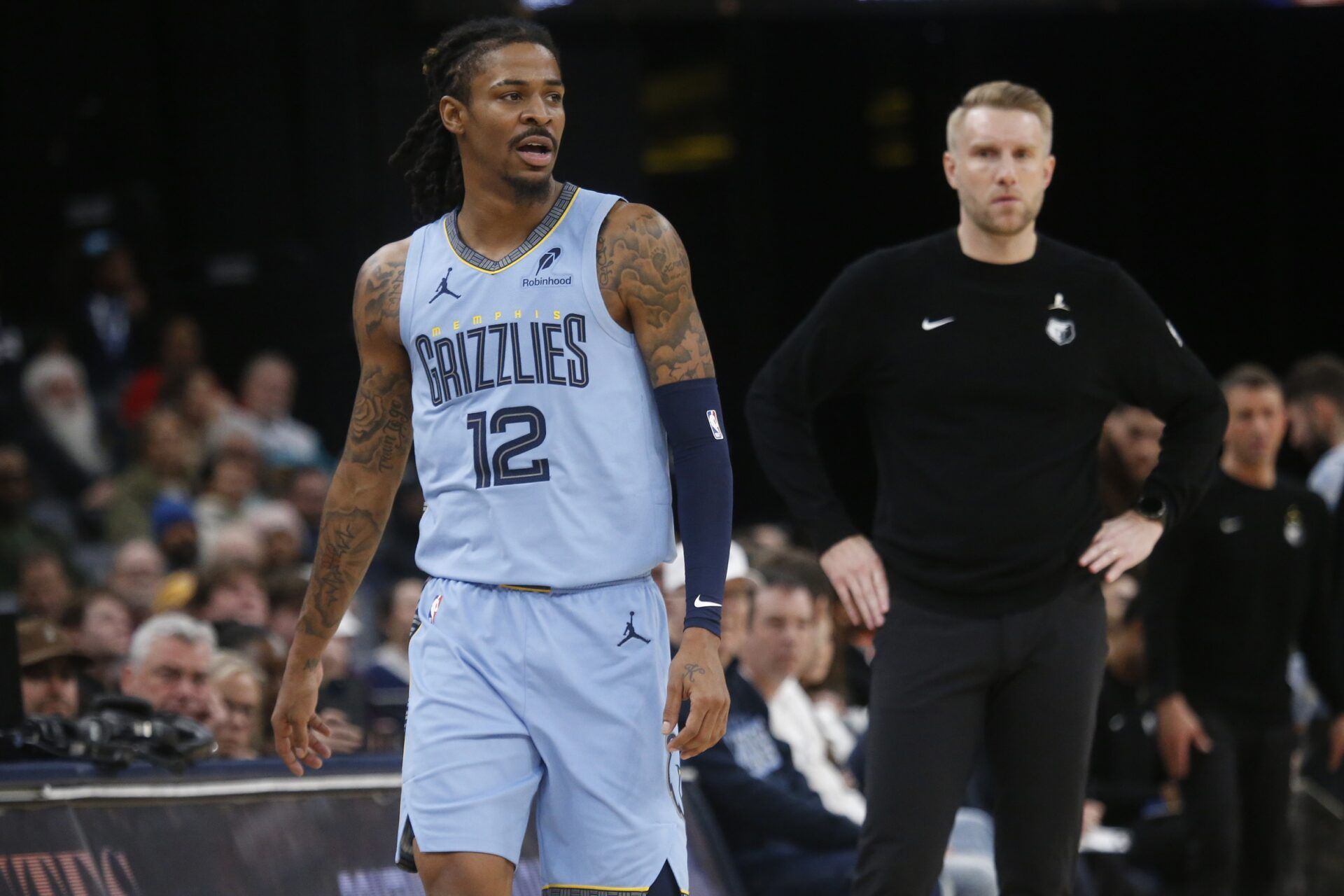 Memphis Grizzlies guard Ja Morant (12) and head coach Tuomas Iisalo looks on during the third quarter against the Atlanta Hawks at FedExForum.