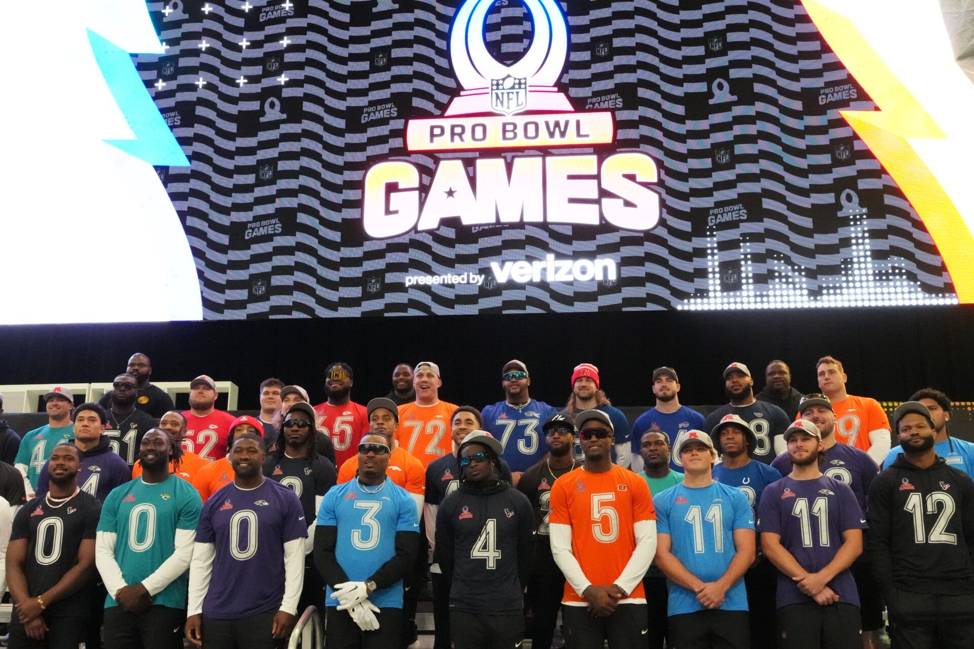 AFC players pose for team photo at the Flag Fieldhouse Moscone Center South Building.