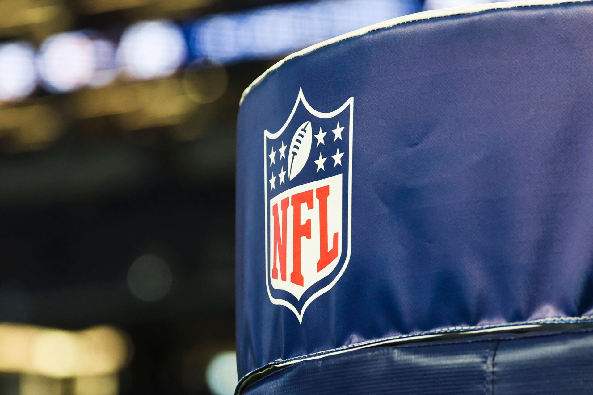 Detail of NFL logo on a goal post pad before a game between the Los Angeles Chargers and Dallas Cowboys at AT&T Stadium.
