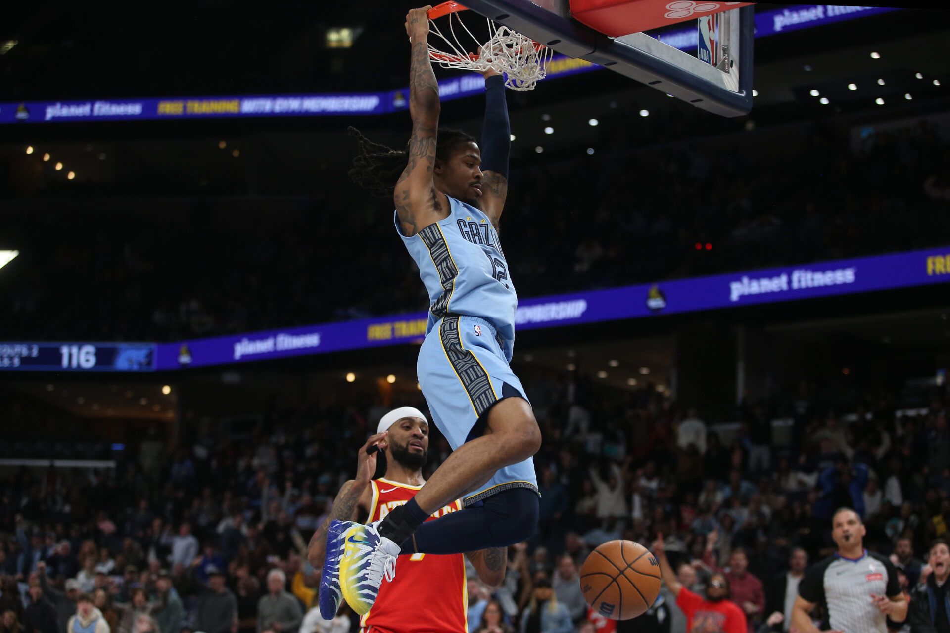 Memphis Grizzlies guard Ja Morant (12) dunks during the fourth quarter against the Atlanta Hawks at FedExForum.