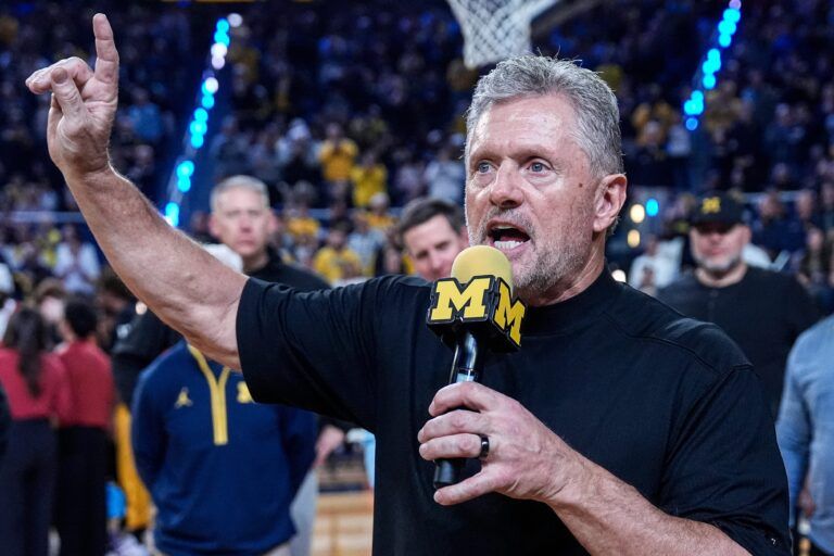 Michigan football head coach Kyle Whittingham speaks as he is being introduced on the floor during the first half between Michigan and USC at Crisler Center in Ann Arbor on Friday, Jan. 2, 2026.