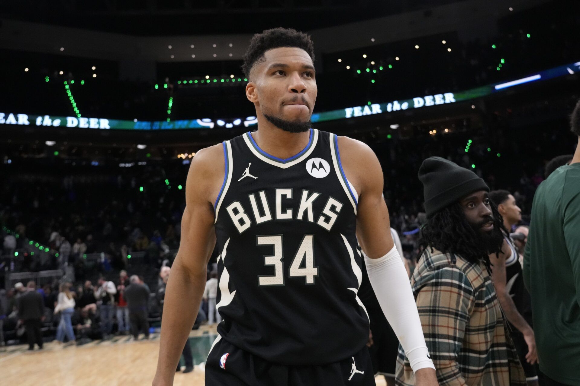 Milwaukee Bucks forward Giannis Antetokounmpo (34) walks from the court following the game against the Denver Nuggets at Fiserv Forum.