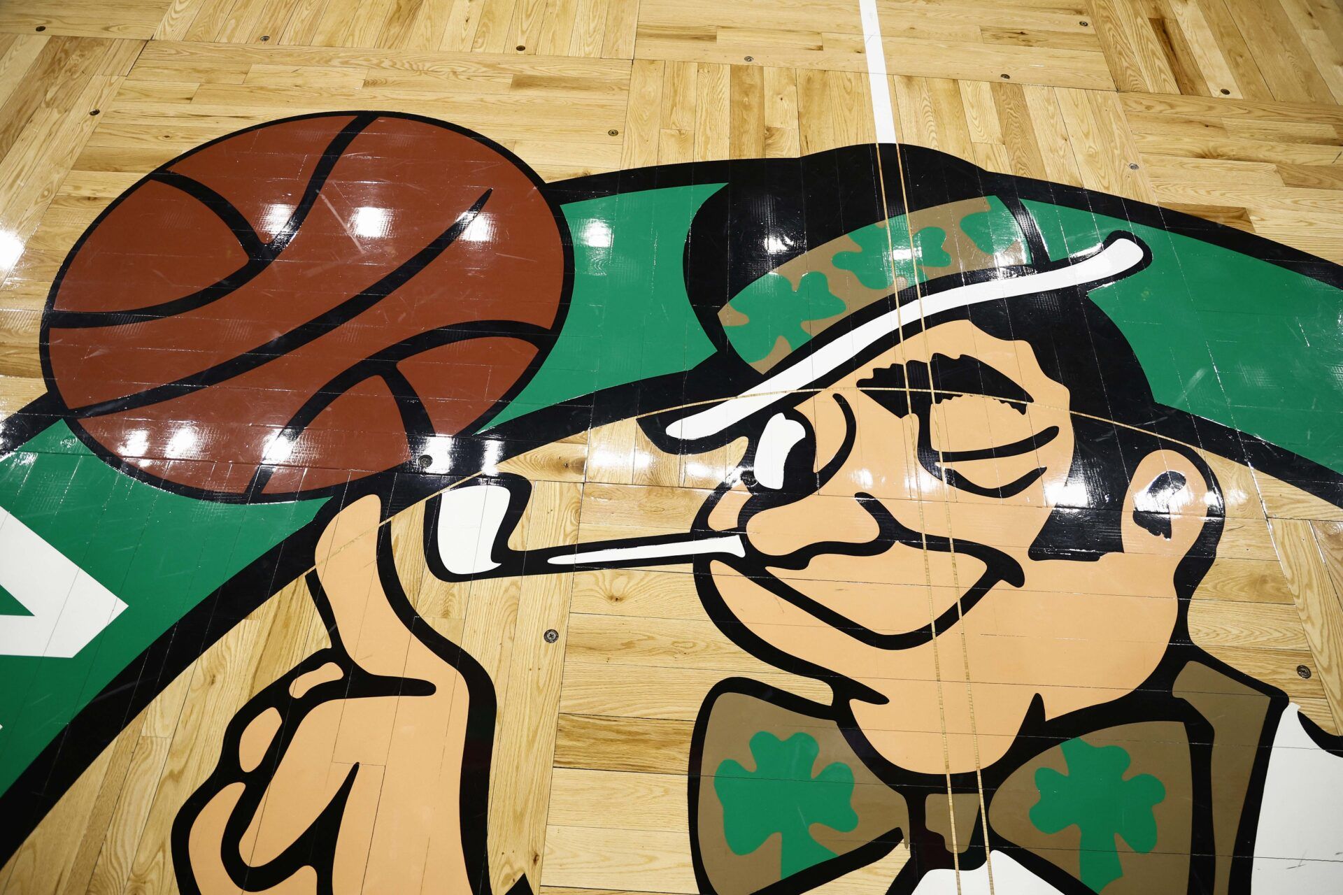 The Boston Celtics logo is seen on the court before the game between the Boston Celtics and the Portland Trail Blazers at TD Garden.
