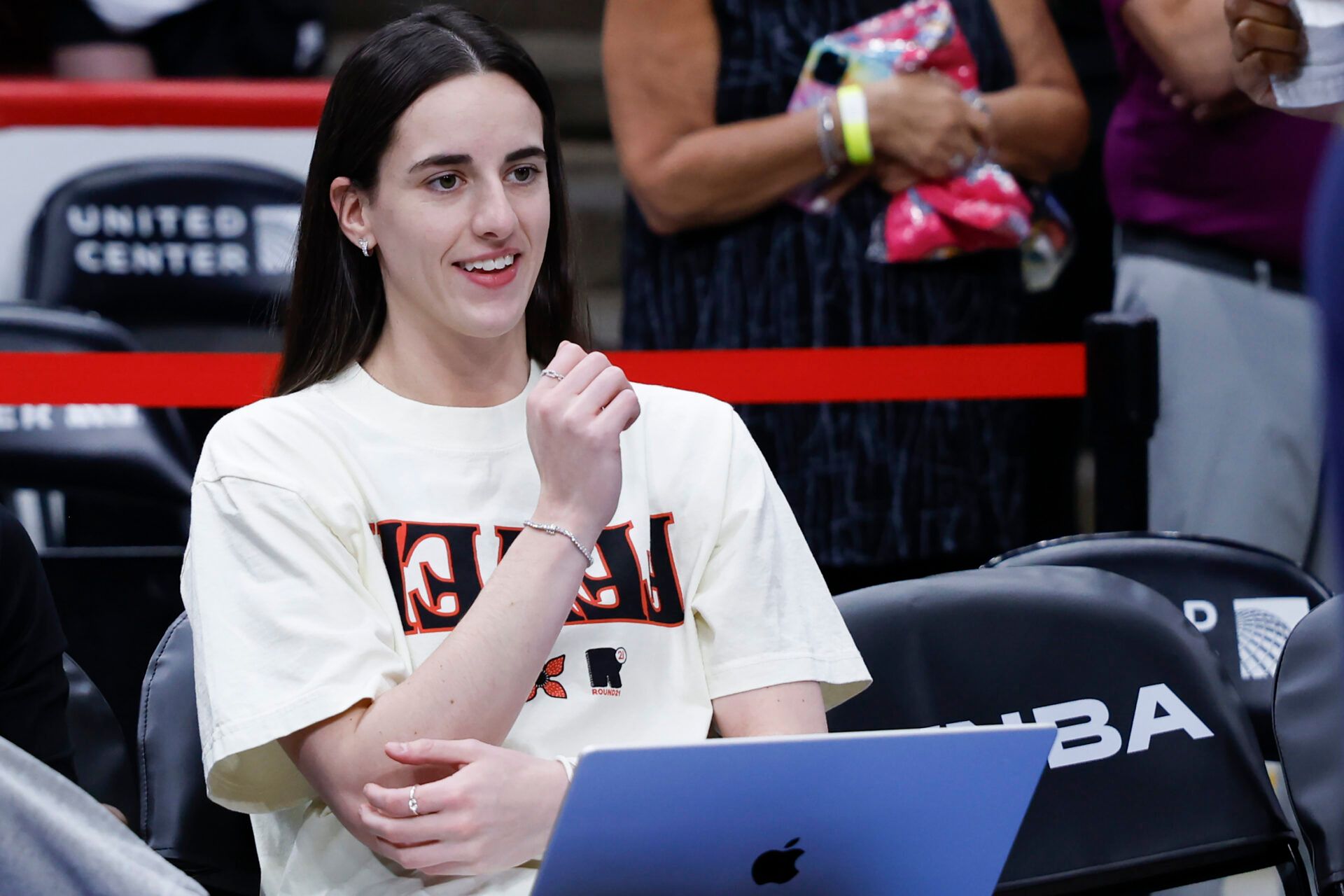 Indiana Fever guard Caitlin Clark (22) smiles before a WNBA game against the Chicago Sky at United Center.