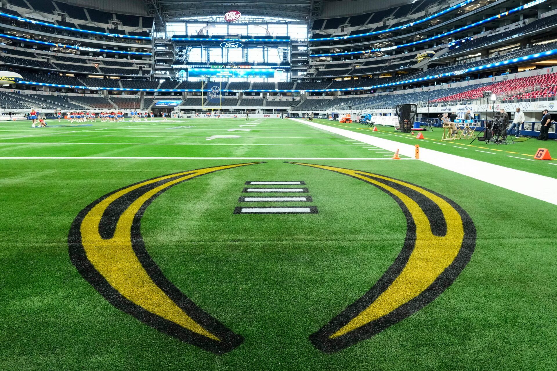 The College Football Playoff logo is painted in the endzone prior to the Cotton Bowl between the Ohio State Buckeyes and the Miami Hurricanes at AT&T Stadium in Arlington, Texas on Dec. 31, 2025.