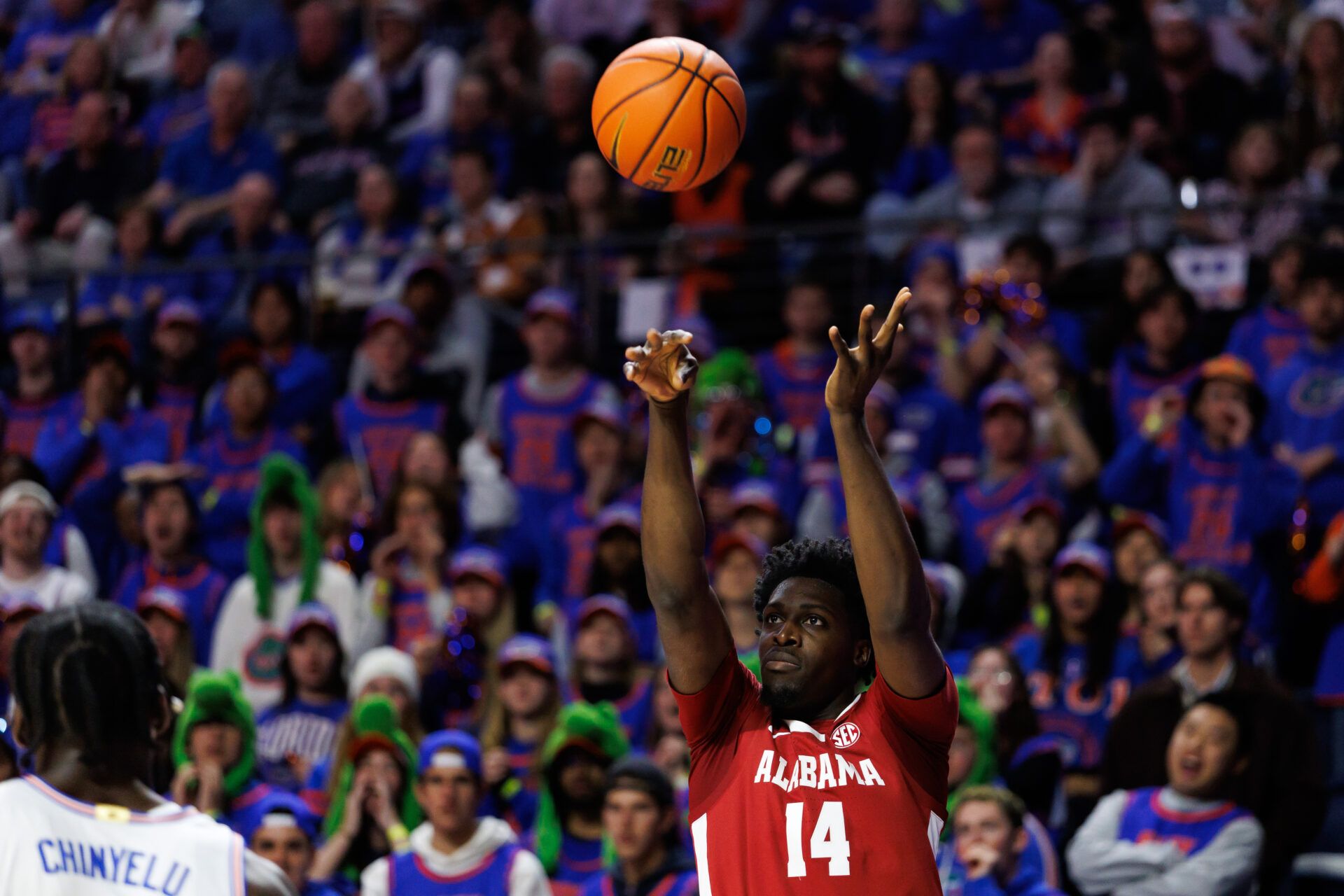 Alabama Crimson Tide center Charles Bediako (14) shoots the ball over Florida Gators center Rueben Chinyelu (9) during the first half at Exactech Arena at the Stephen C. O'Connell Center.
