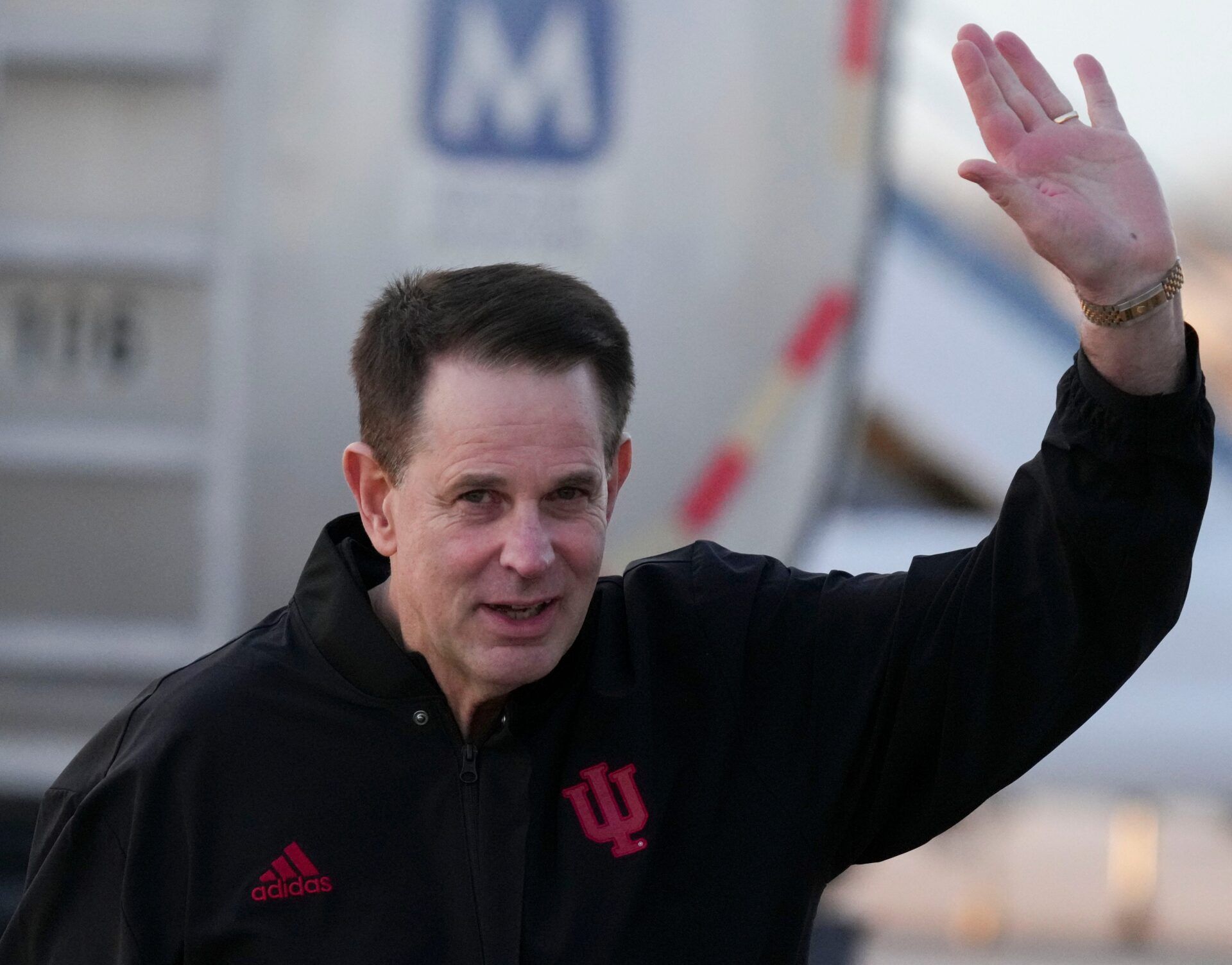 Indiana head coach Curt Cignetti waves to media members as his team returns home after beating Miami in the College Football Playoff national championship game on Tuesday, Jan. 20, 2026, in Indianapolis.