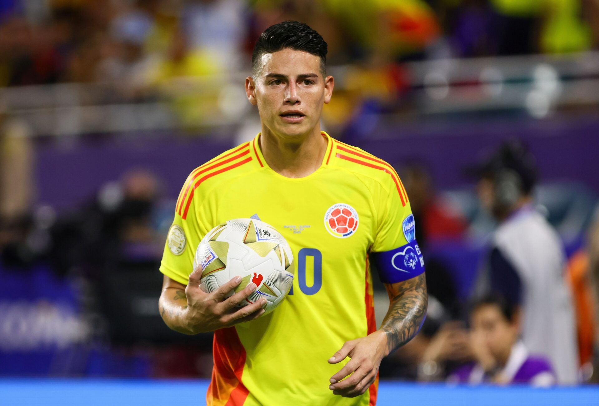 Colombia midfielder James Rodriguez (10) walks toward the corner kick against Argentina during the second half of the Copa America final at Hard Rock Stadium.