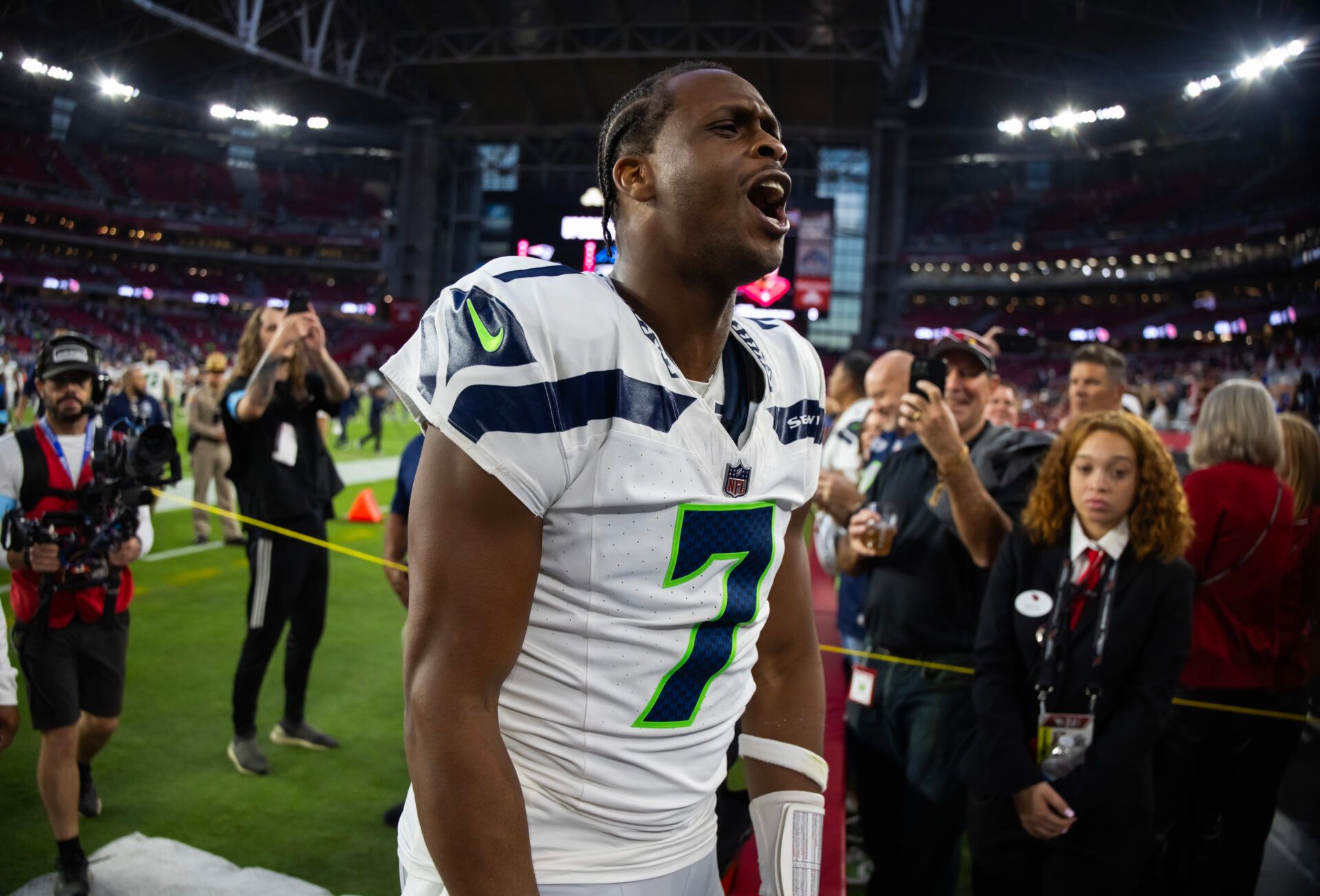 Seattle Seahawks quarterback Geno Smith (7) celebrates after defeating the Arizona Cardinals at State Farm Stadium.