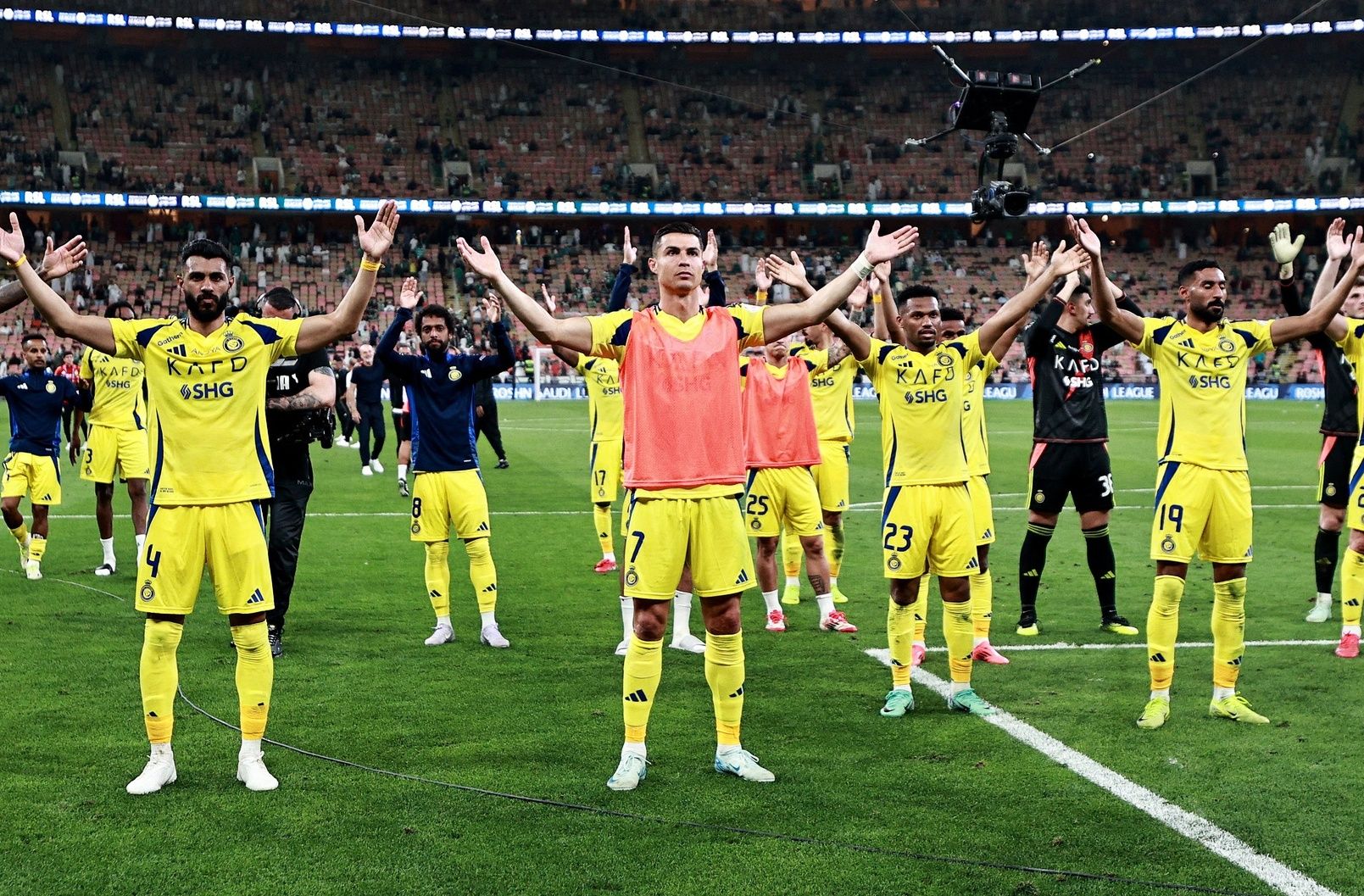 [US, Mexico & Canada customers only] Feb 13, 2024; Jeddah, Saudi Arabia; Al Nassr players including Cristiano Ronaldo, Mohammed Al-Fatil and Jhon Duran celebrate after a Saudi Pro League soccer match at King Abdullah Sports City.