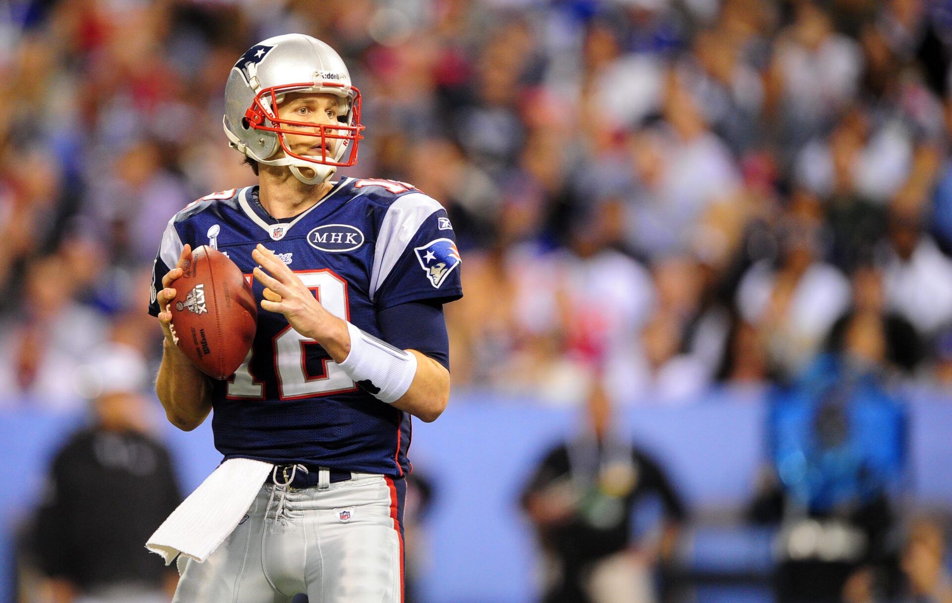 New England Patriots quarterback Tom Brady (12) drops back to pass during the second half of Super Bowl XLVI against the New York Giants at Lucas Oil Stadium.