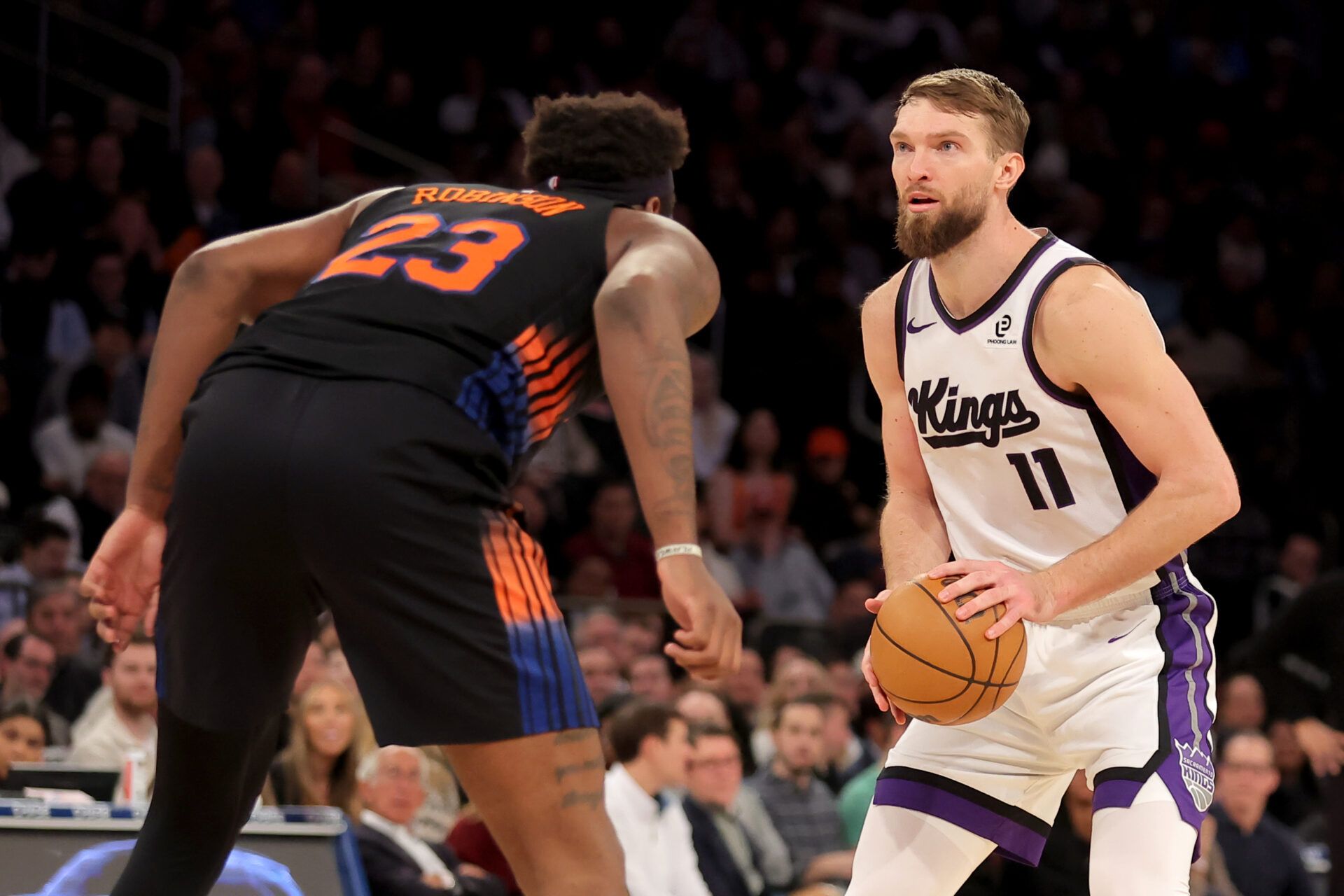 Sacramento Kings forward Domantas Sabonis (11) looks to shoot the ball against New York Knicks center Mitchell Robinson (23) during the fourth quarter at Madison Square Garden.
