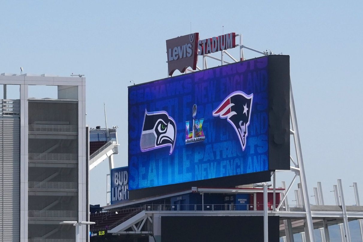 The Seattle Seahawks, New England Patriots and the Super Bowl 60 logos on the video board at Levi's Stadium.