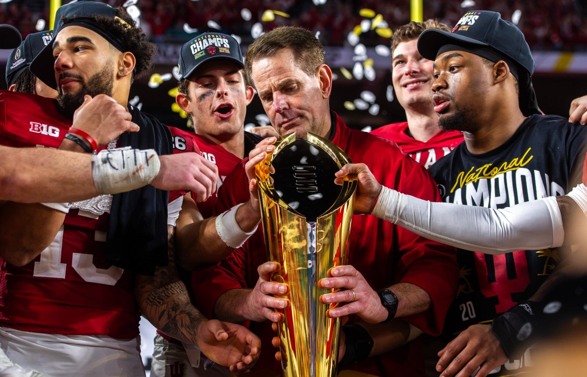 Indiana Head Coach Curt Cignetti prepares to lift the trophy on the podium after the College Football Playoff National Championship college football game at Hard Rock Stadium in Miami Gardens on Monday, Jan. 19, 2026.