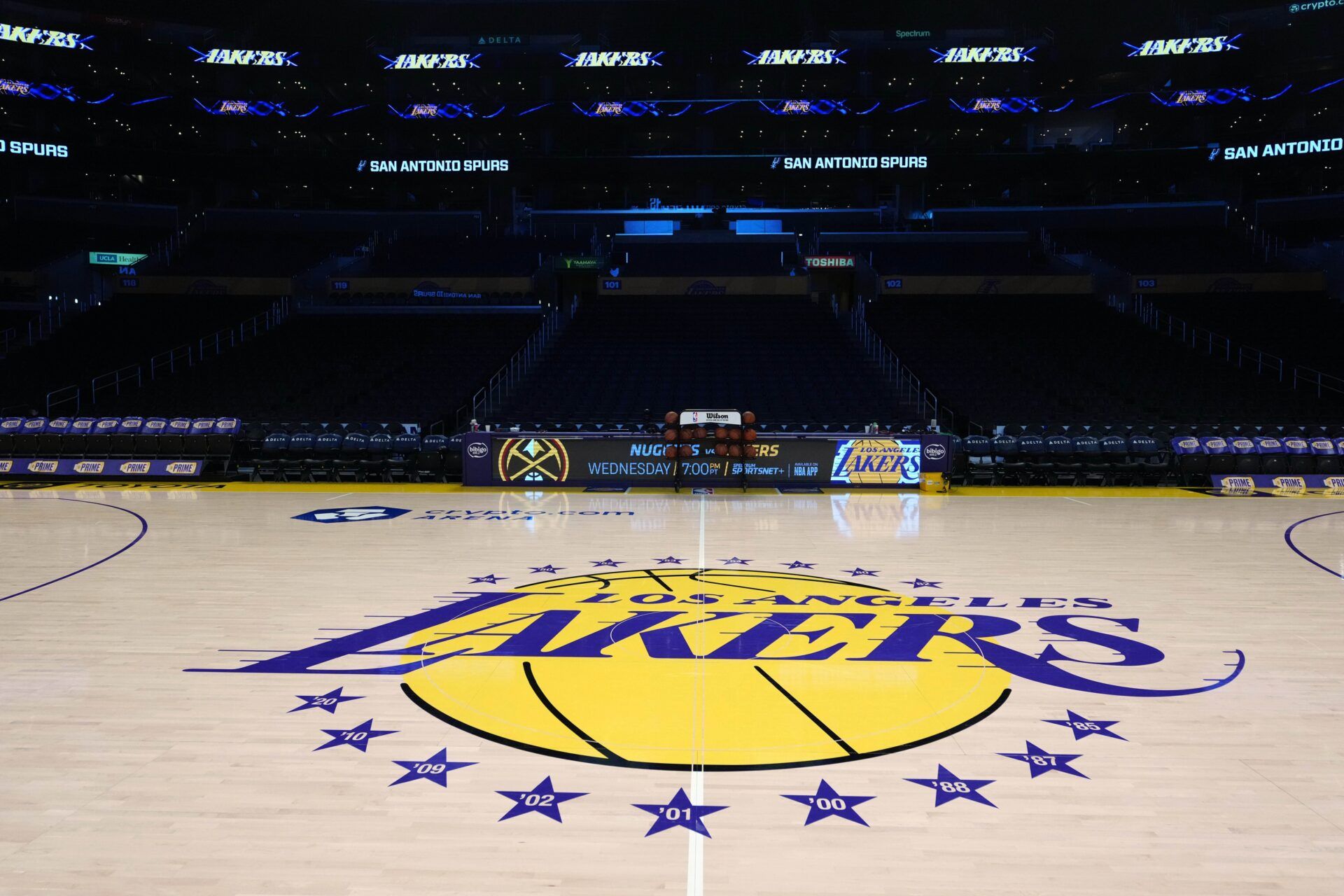 The Los Angeles Lakers logo at midcourt at Crypto.com Arena.