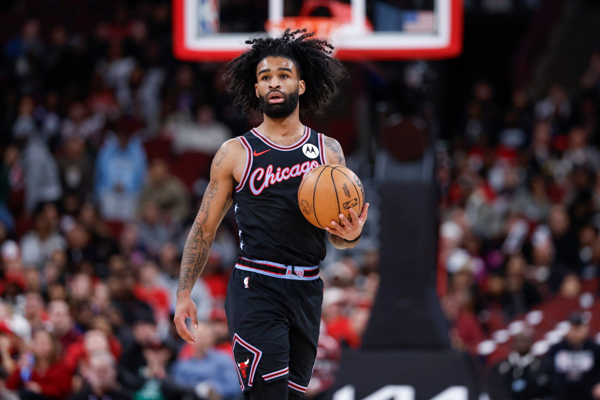 Chicago Bulls guard Coby White (0) brings the ball up court against the Miami Heat during the first half at United Center.