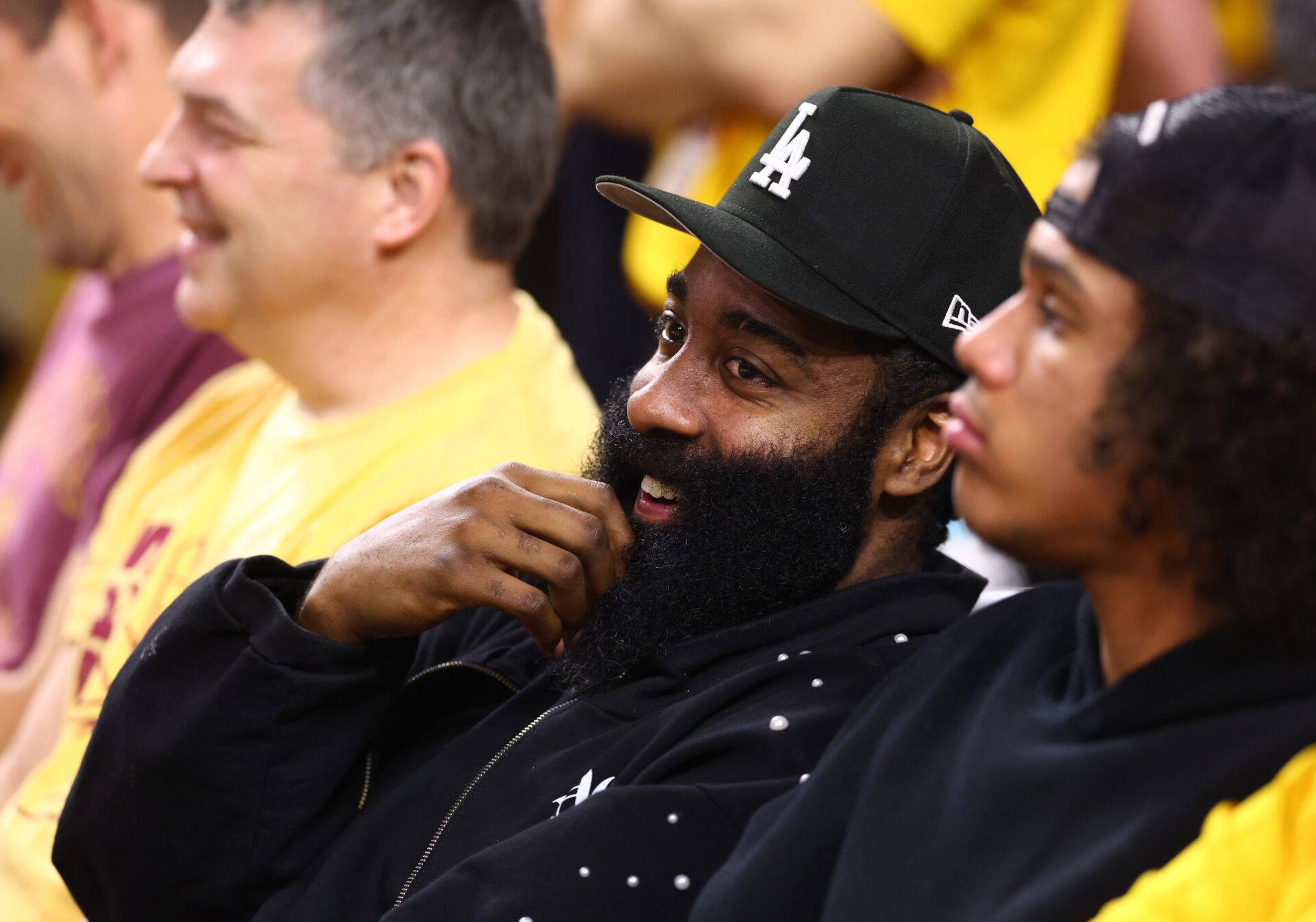 Arizona State Sun Devils former player James Harden sits courtside during the game against the Arizona Wildcats in the second half at Desert Financial Arena.