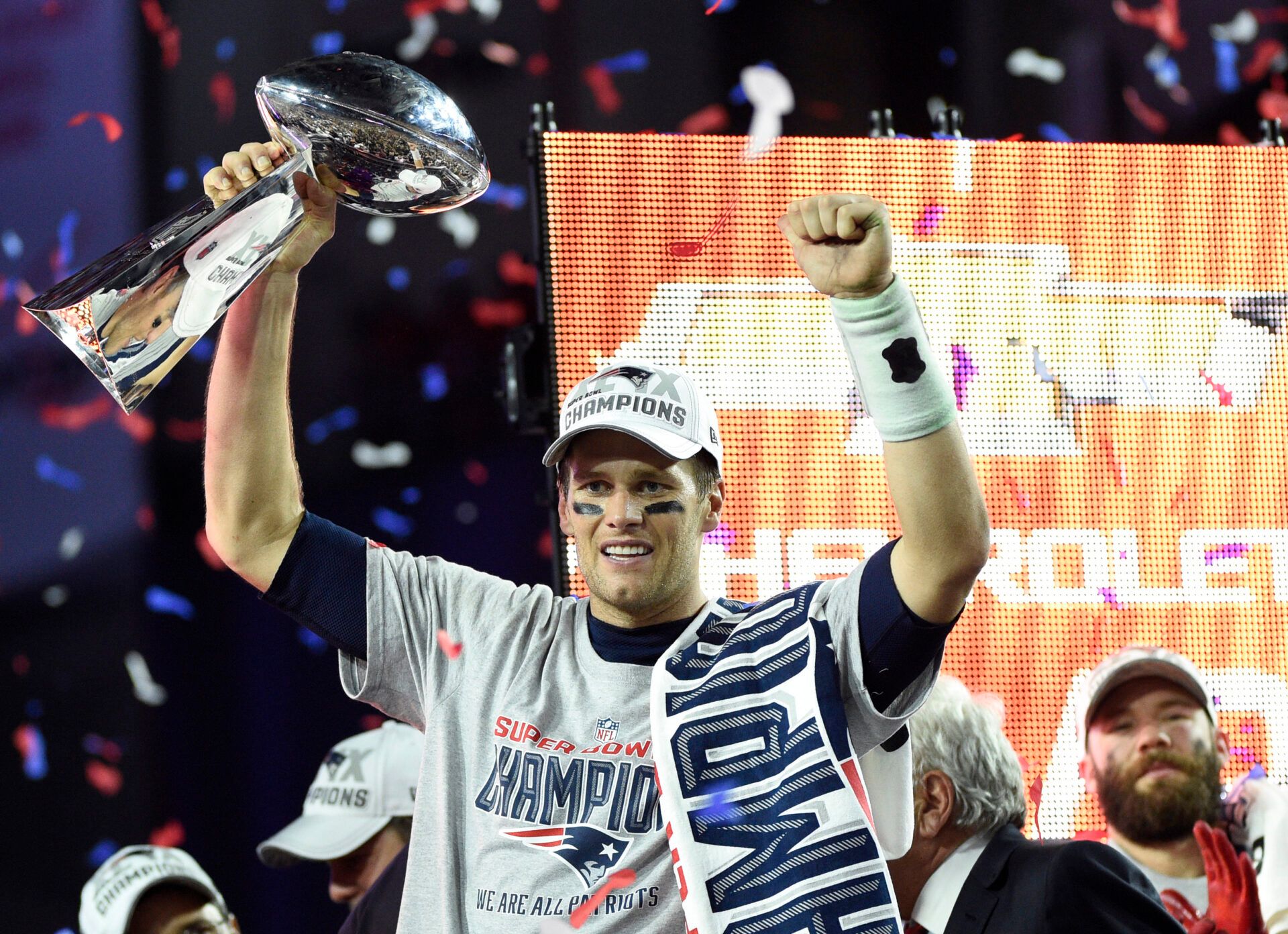 New England Patriots quarterback Tom Brady (12) hoists the Vince Lombardi Trophy after defeating the Seattle Seahawks  in Super Bowl XLIX at University of Phoenix Stadium.