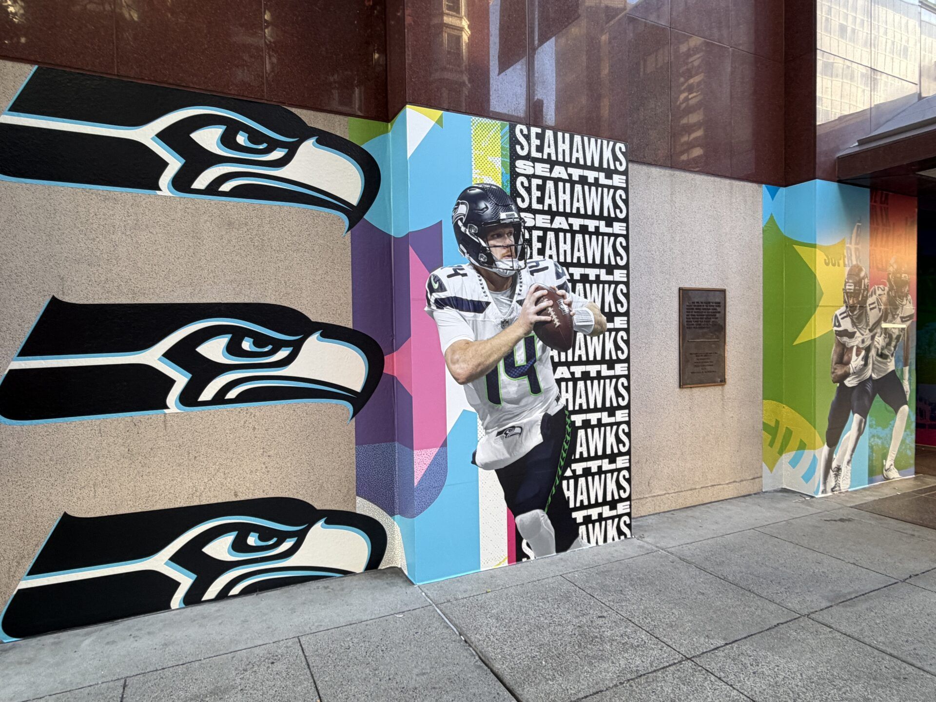 An image of Seattle Seahawks quarterback Sam Darnold (14) and the Seahawks logo at the Marriott Marquis hotel.