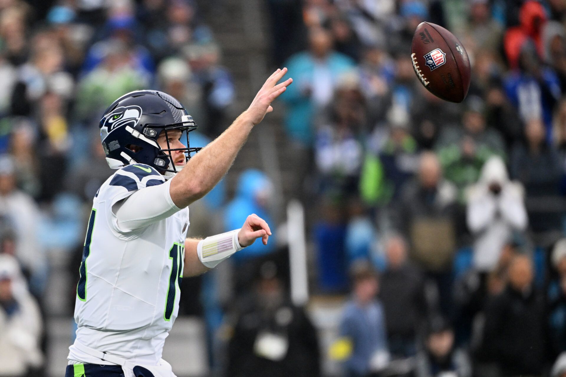 Seattle Seahawks quarterback Sam Darnold (14) throws a pass and is called for intentional grounding against the Carolina Panthers during the first quarter at Bank of America Stadium.
