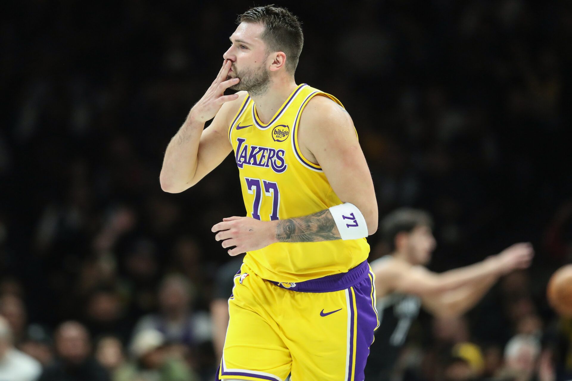 Los Angeles Lakers guard Luka Doncic (77) gestures after scoring in the first quarter against the Brooklyn Nets at Barclays Center.