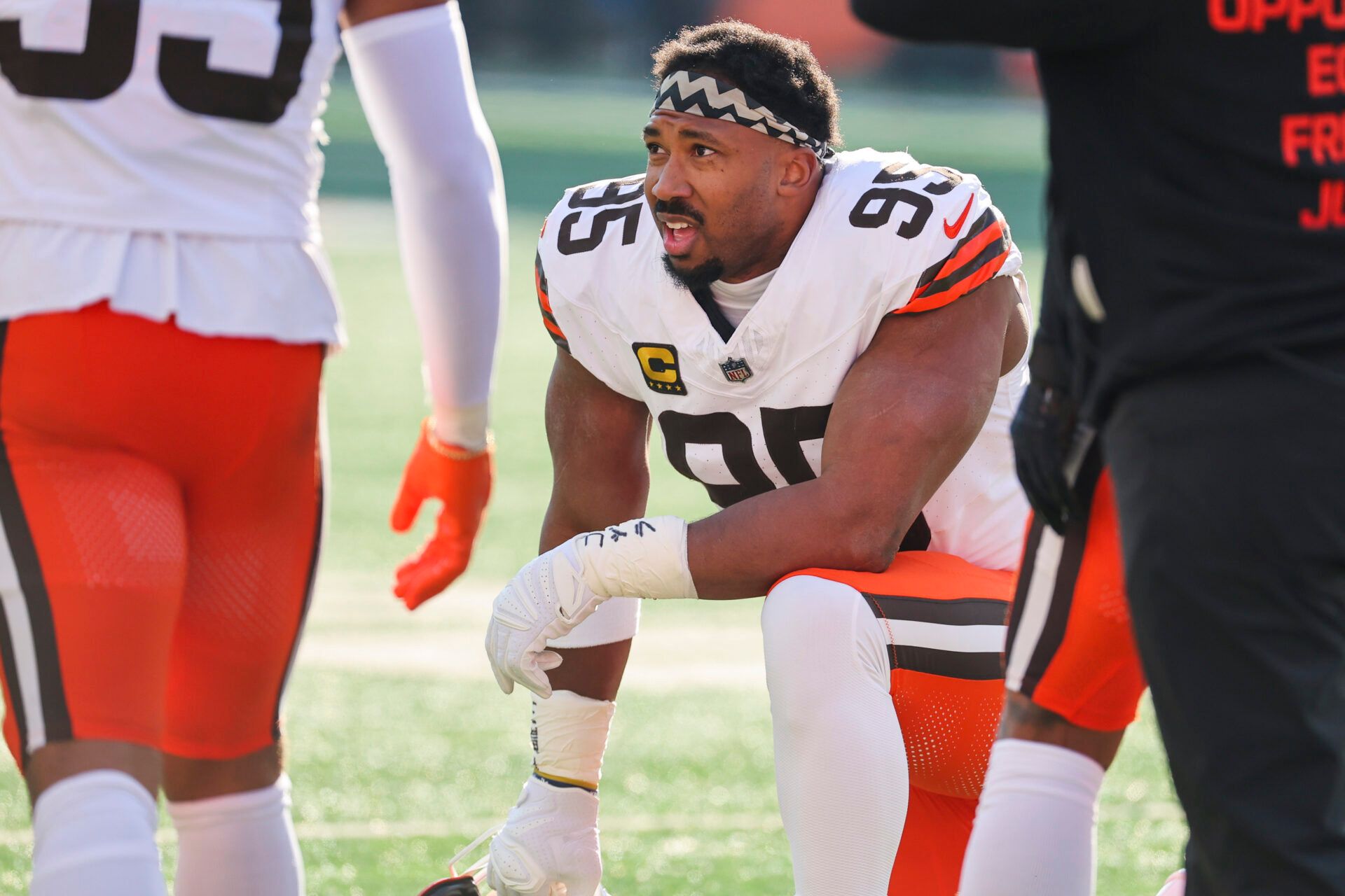 Cleveland Browns defensive end Myles Garrett (95) kneels on the field during a first half timeout against the Cincinnati Bengals at Paycor Stadium.