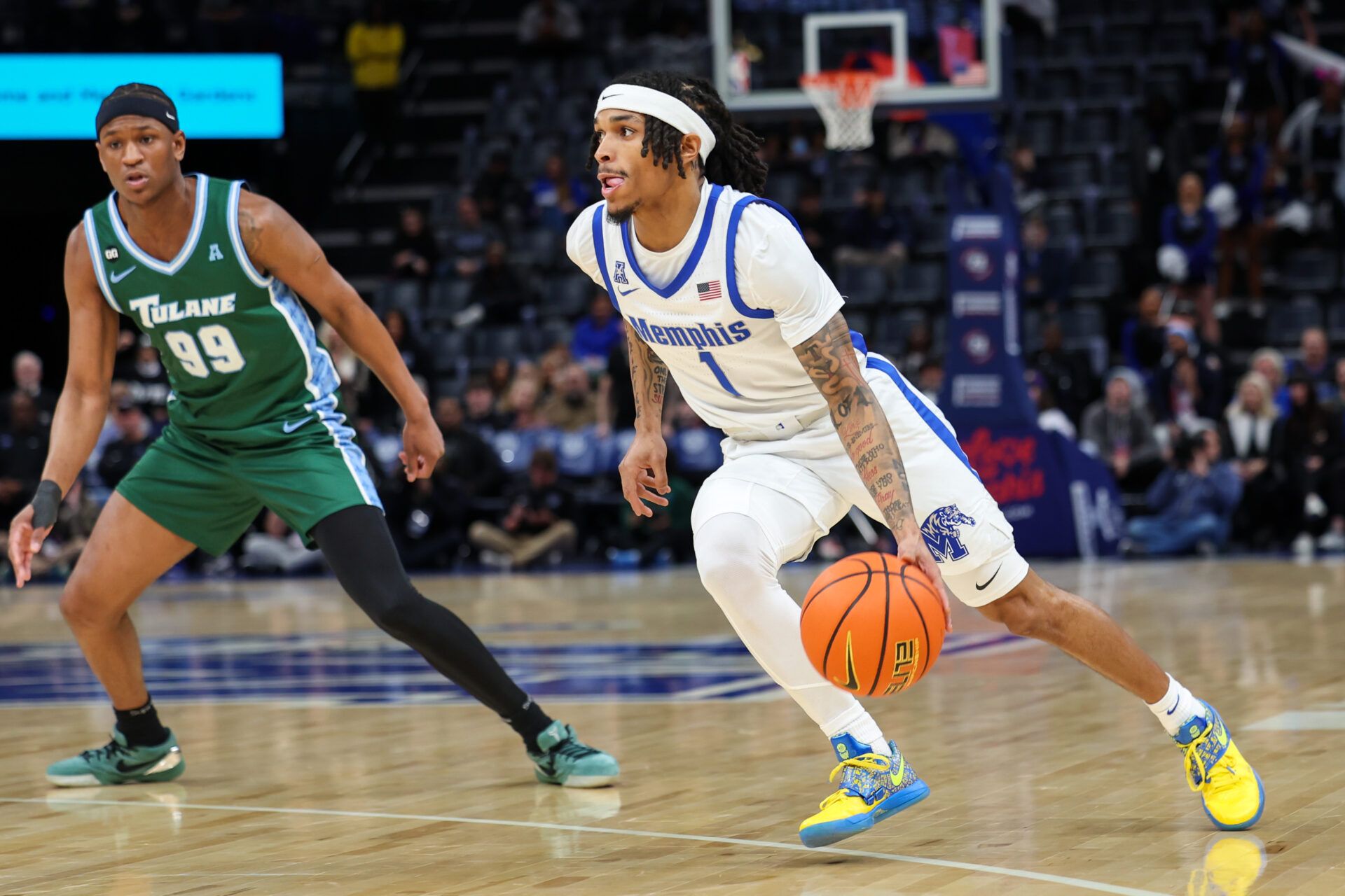 Memphis Tigers guard Dug McDaniel (1) drives to the basket against the Tulane Green Wave during the first half at FedExForum.