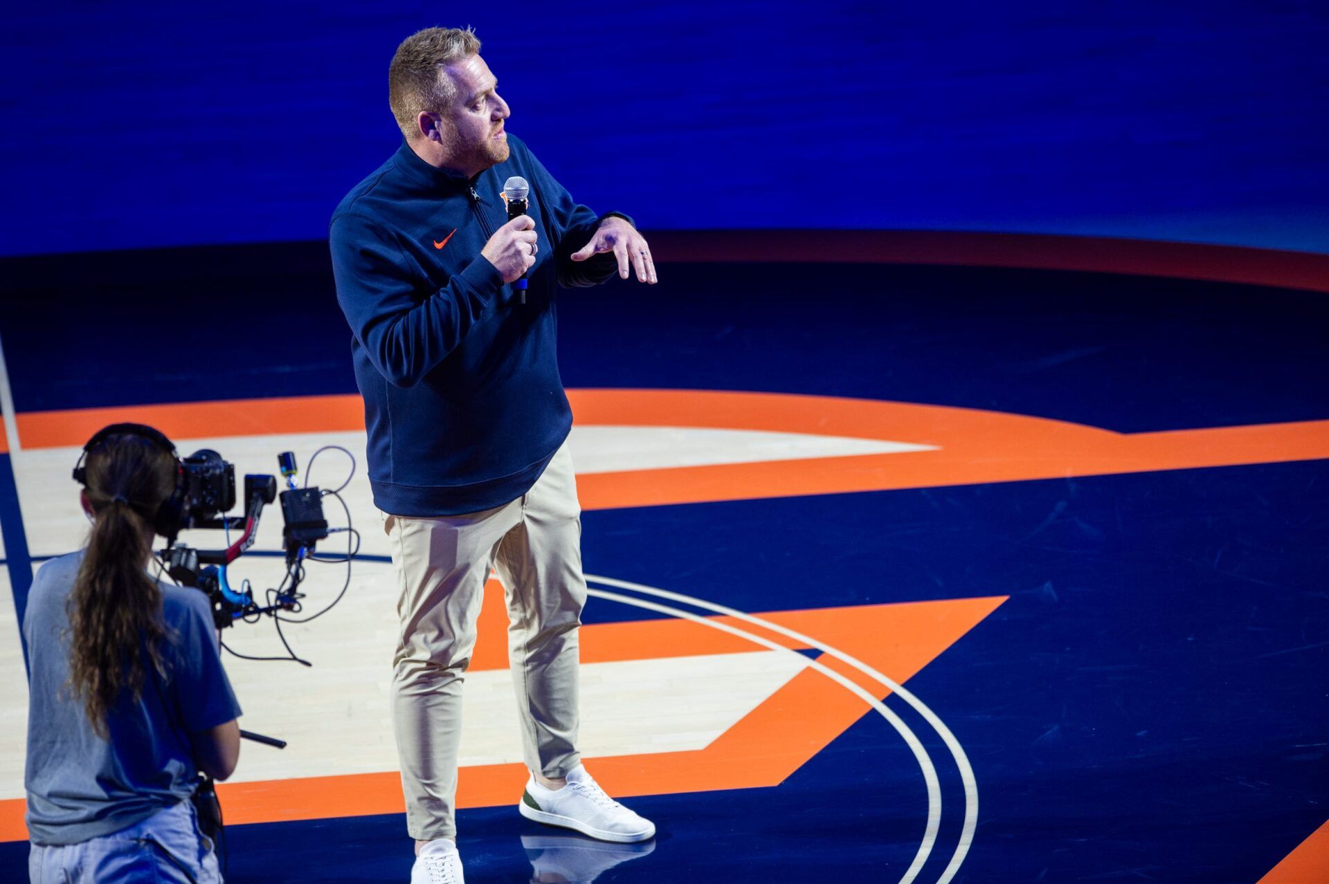 Newly hired Auburn football head coach Alex Golesh talks to fans as Auburn Tigers take on NC State Wolfpack at Neville Arena in Auburn, Ala. on Wednesday, Dec. 3, 2025. Auburn Tigers lead NC State Wolfpack 41-35 at halftime.