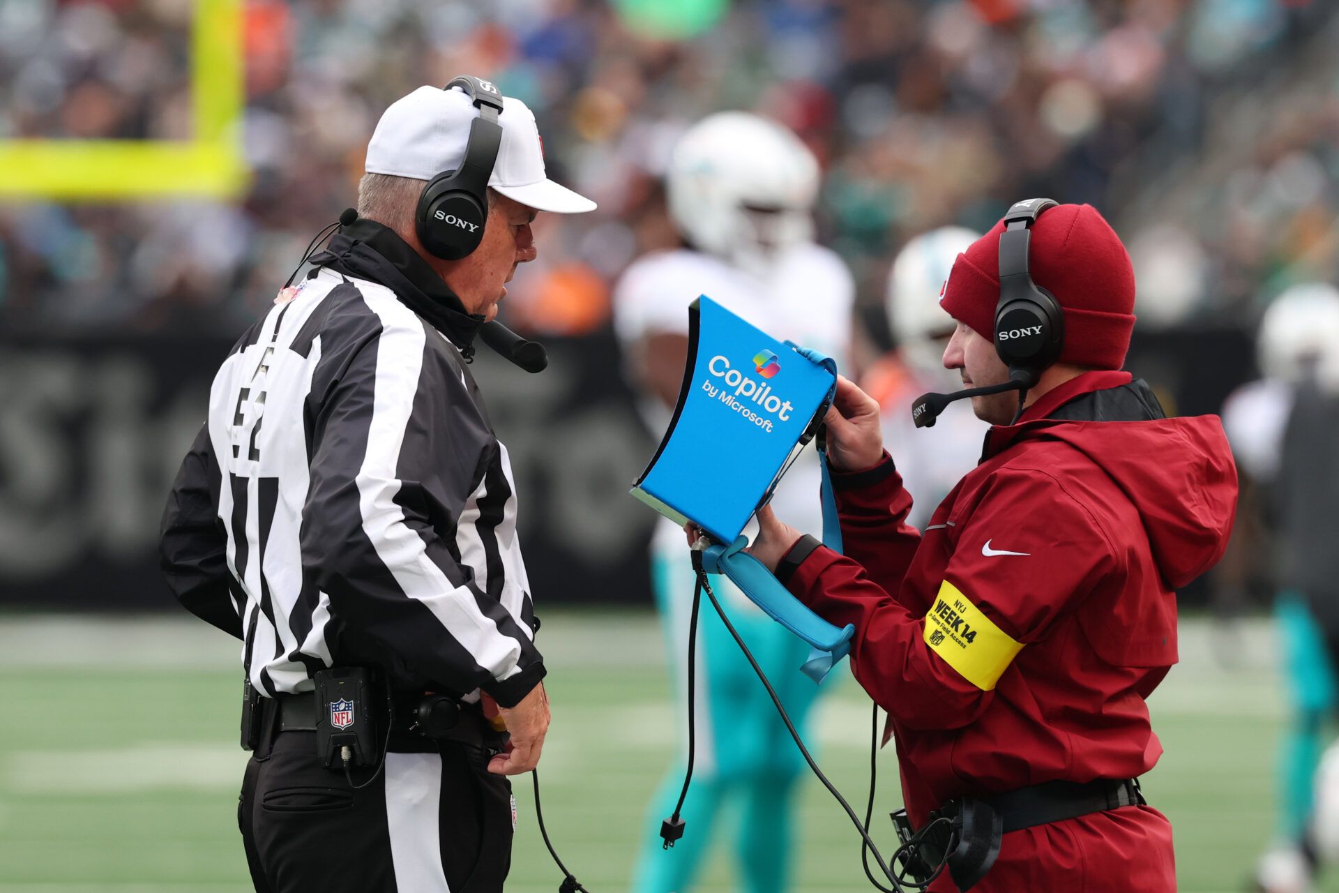 Referee Bill Vinovich (52) watches a replay during the first half at MetLife Stadium.