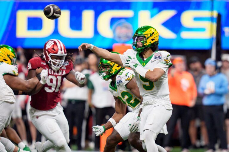 Oregon quarterback Dante Moore throws a pass as the Oregon Ducks face the Indiana Hoosiers in the Peach Bowl on Jan. 9, 2026, at Mercedes-Benz Stadium in Atlanta, Georgia.