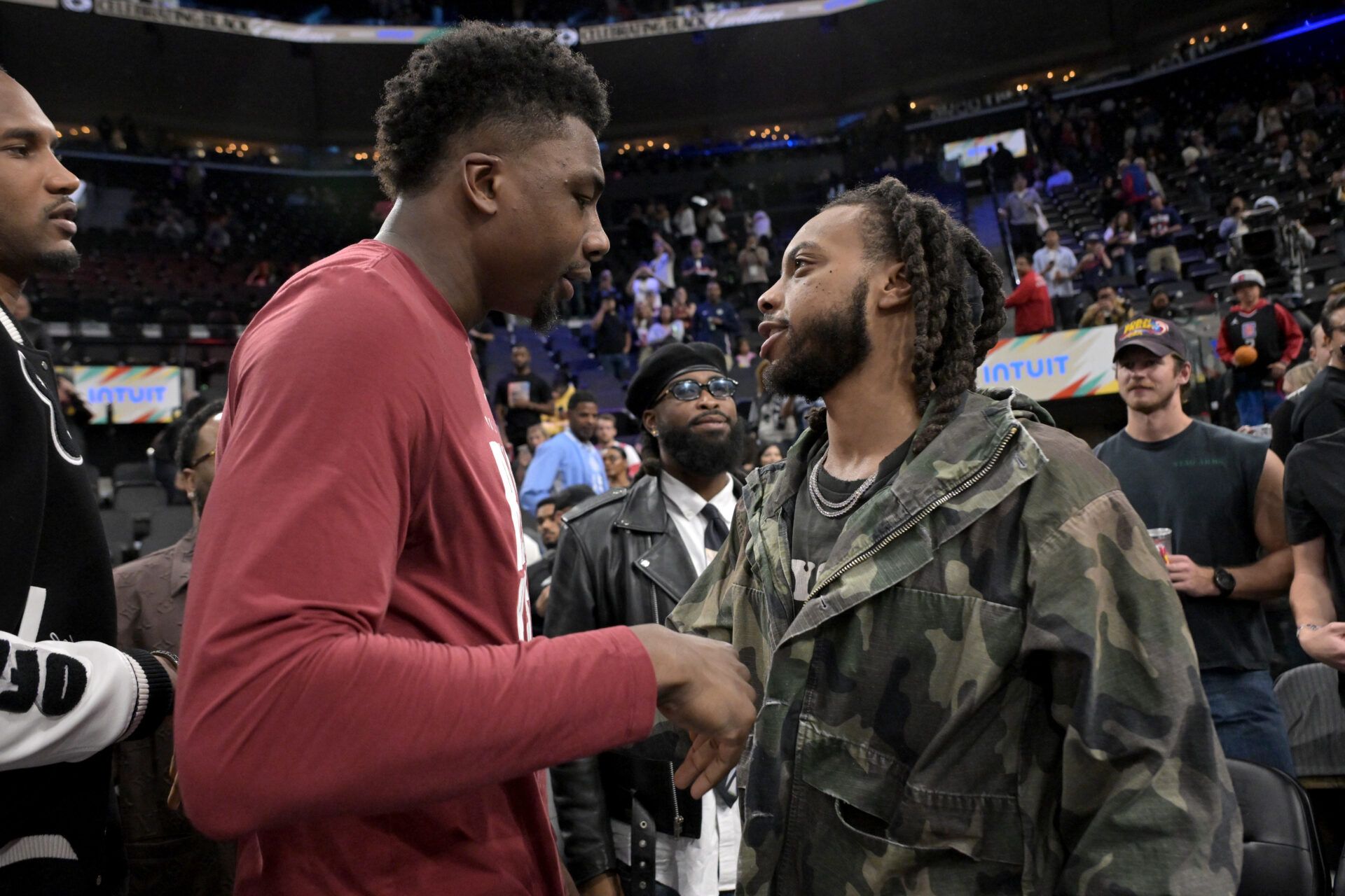 Los Angeles Clippers Darius Garland is greeted by Cleveland Cavaliers center Thomas Bryant (3) following the game at Intuit Dome.