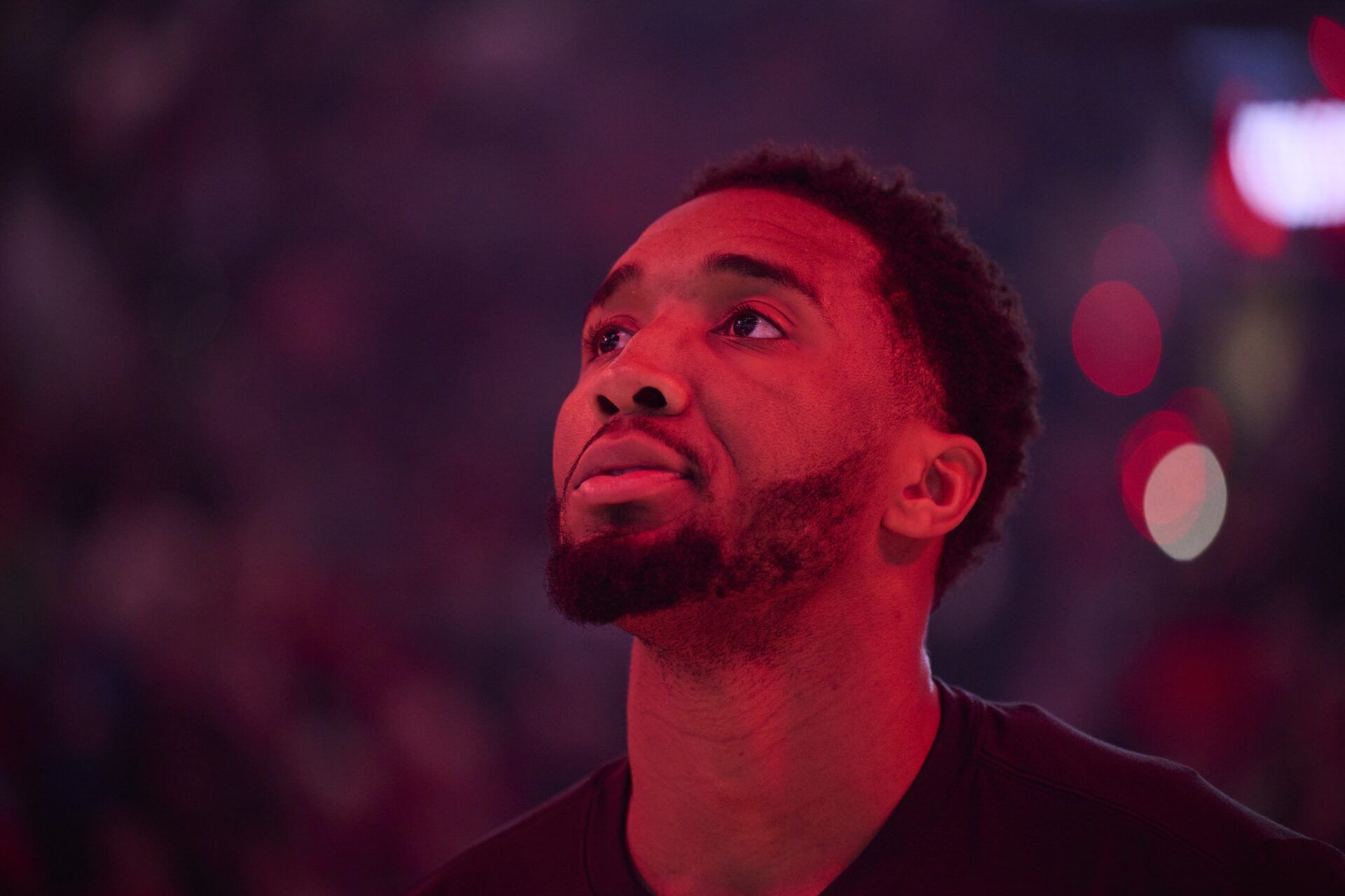 Cleveland Cavaliers guard Donovan Mitchell (45) stands during the singing of the national anthem before a game against the Portland Trail Blazers at Moda Center.