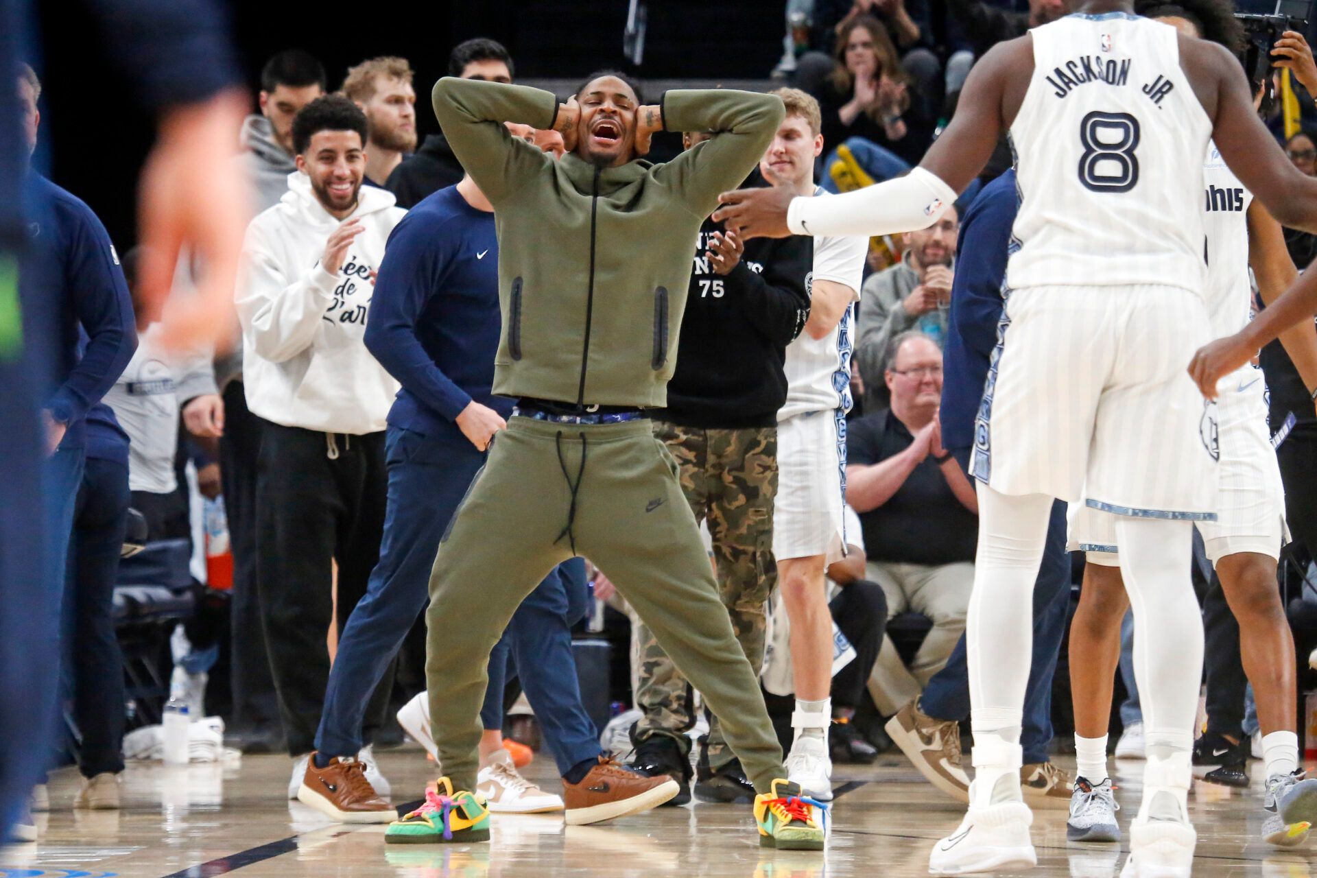 Memphis Grizzlies guard Ja Morant (12) reacts with forward/center Jaren Jackson Jr. (8) after a basket during the fourth quarter against the Minnesota Timberwolves at FedExForum.