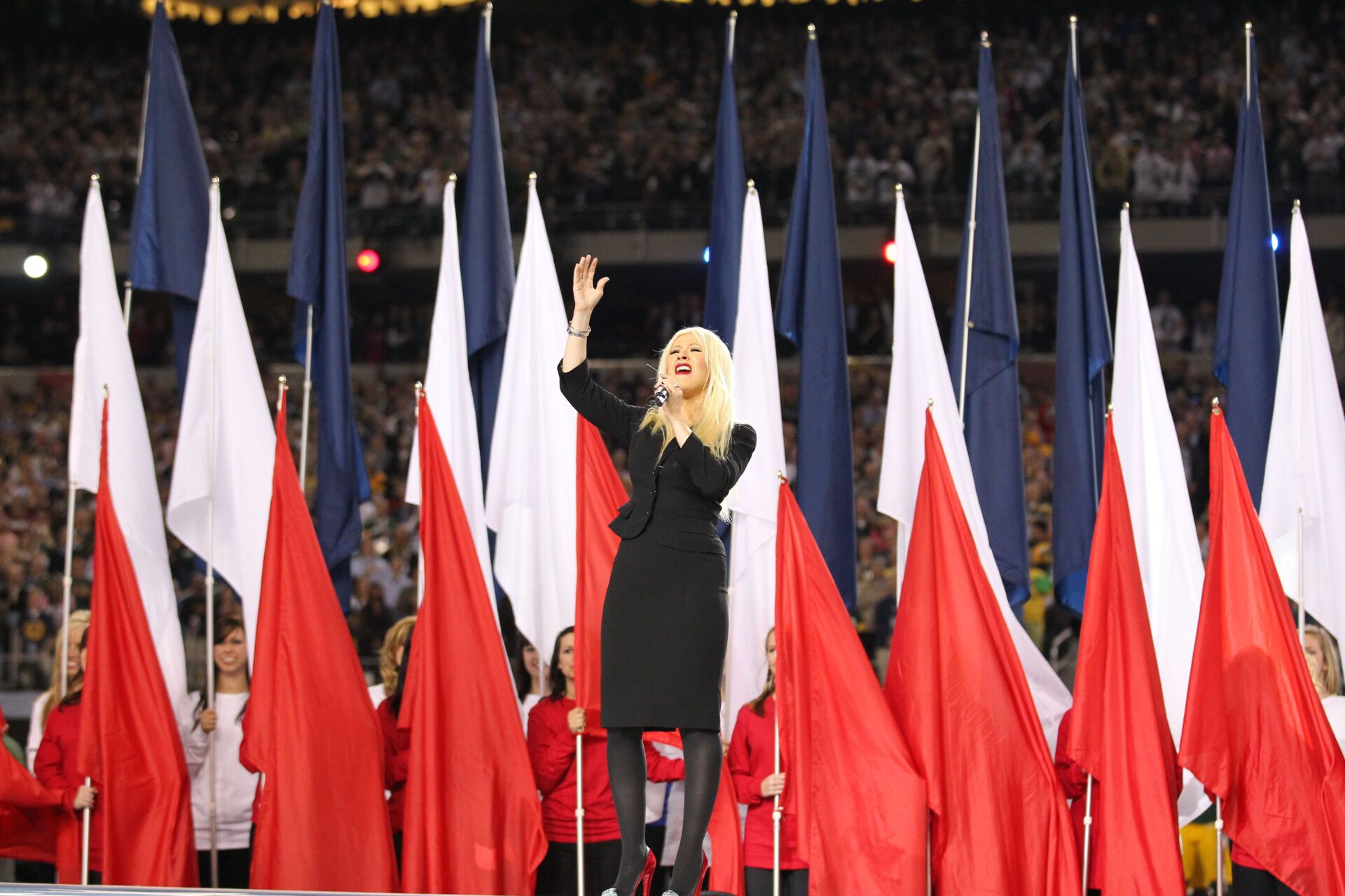 Recording artist Christina Aguilera sings the national anthem before Super Bowl XLV between the Green Bay Packers and the Pittsburgh Steelers at Cowboys Stadium.