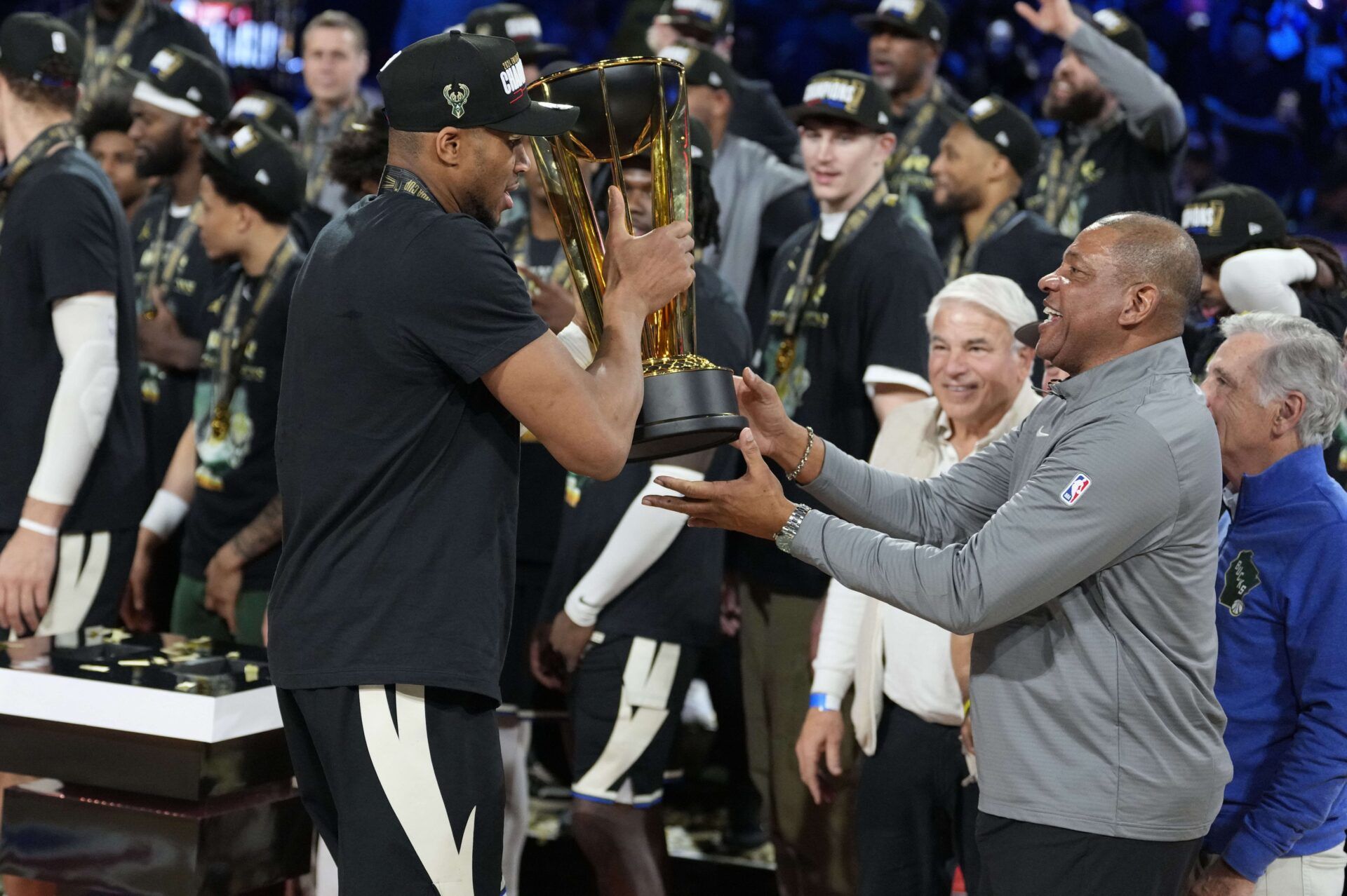 Milwaukee Bucks forward Giannis Antetokounmpo (34) hands the trophy to head coach Doc Rivers after winning the Emirates NBA Cup championship game against the Oklahoma City Thunder at T-Mobile Arena.